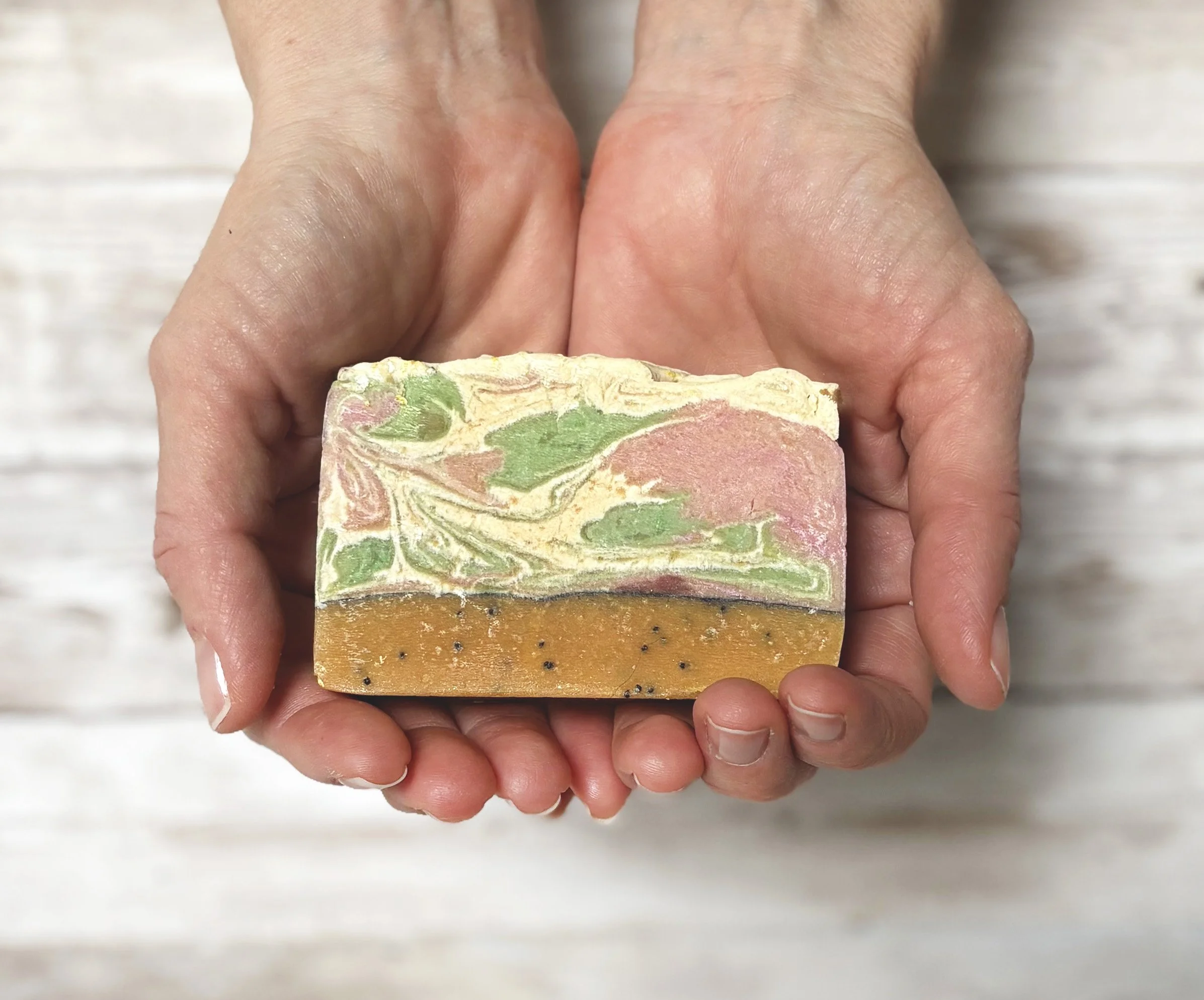 Lemon poppyseed soap in hands.jpg
