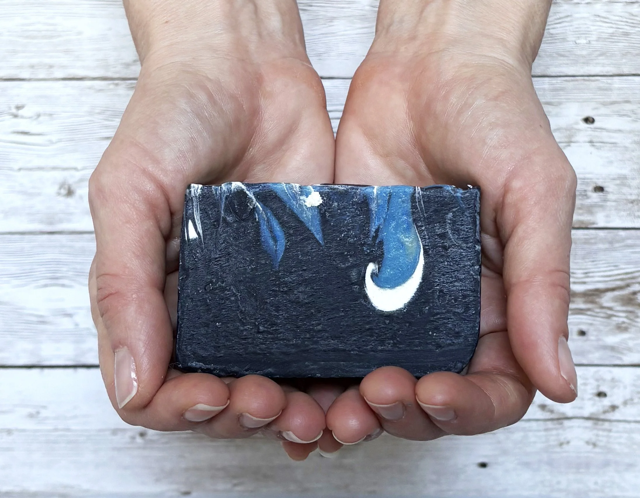 Bamboo charcoal soap in hands.jpg