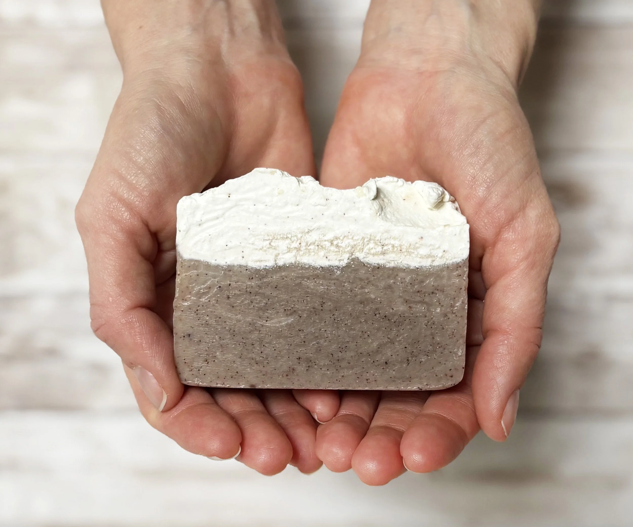 Apricot soap in hands.jpg