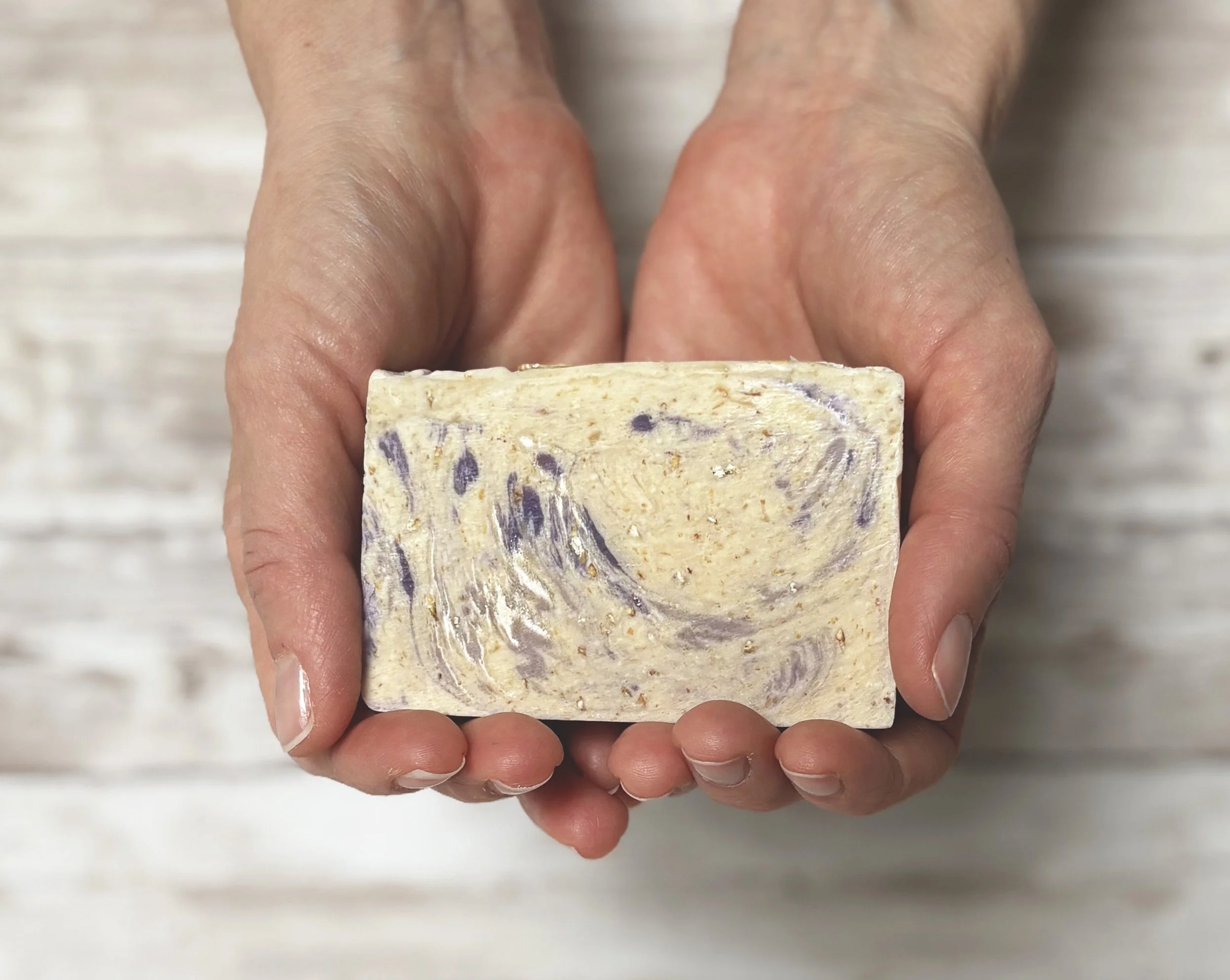 Lavender and oats soap in hands.jpg
