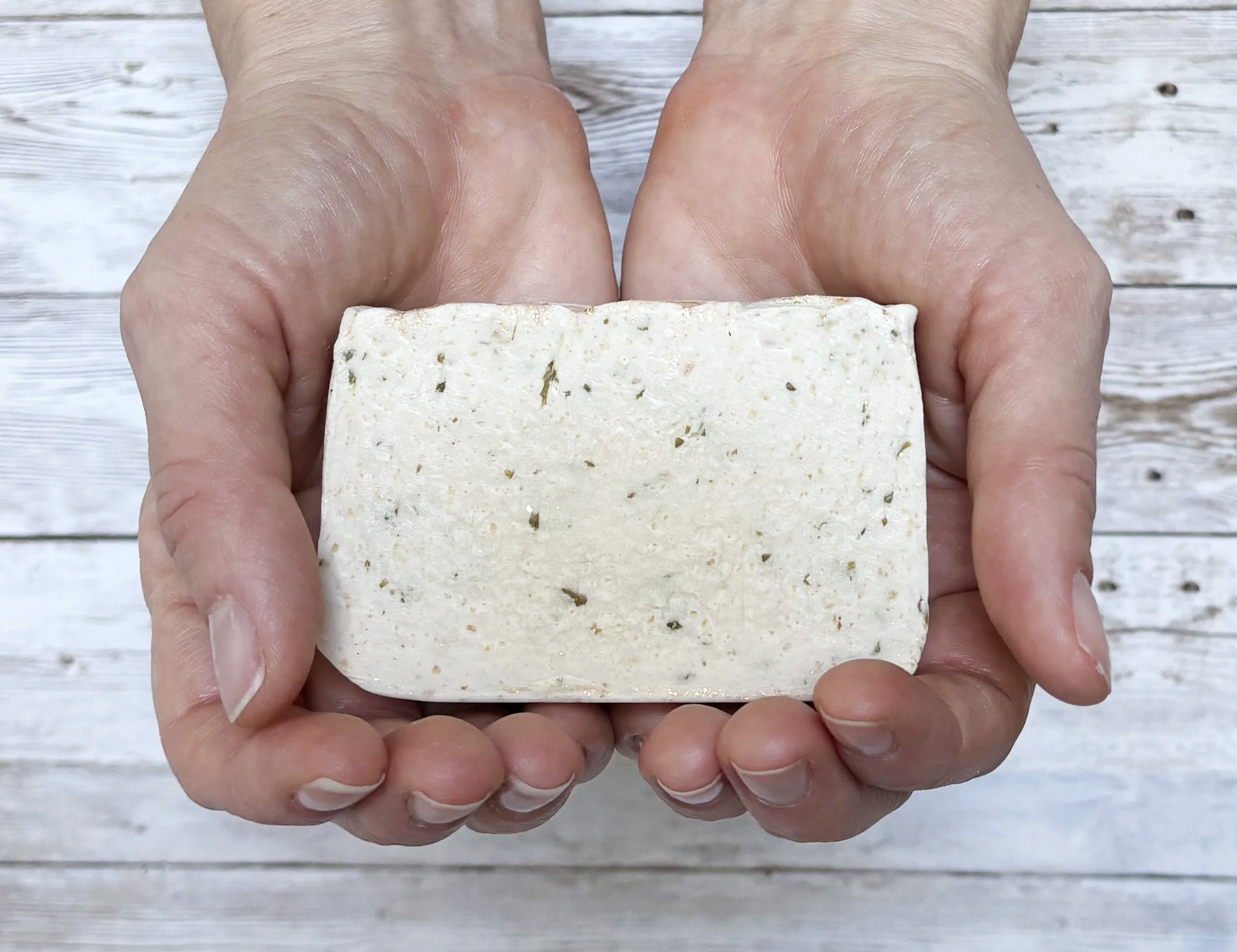 White tea ginger soap in hands.jpg