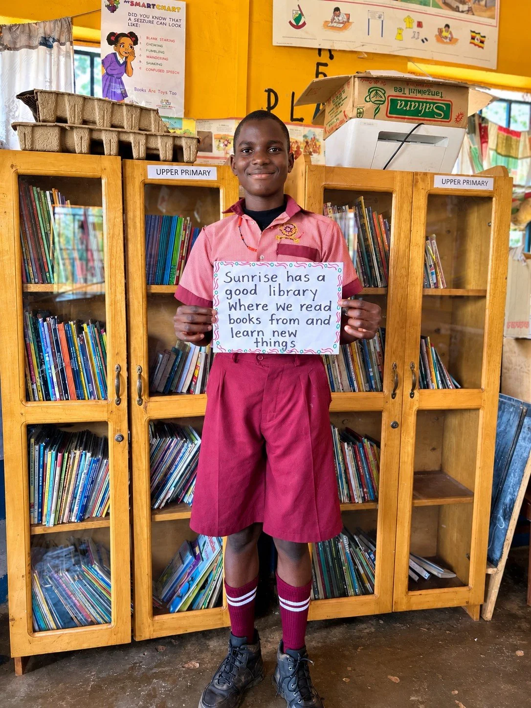 Smiling Student in a Vibrant School Library.jpg