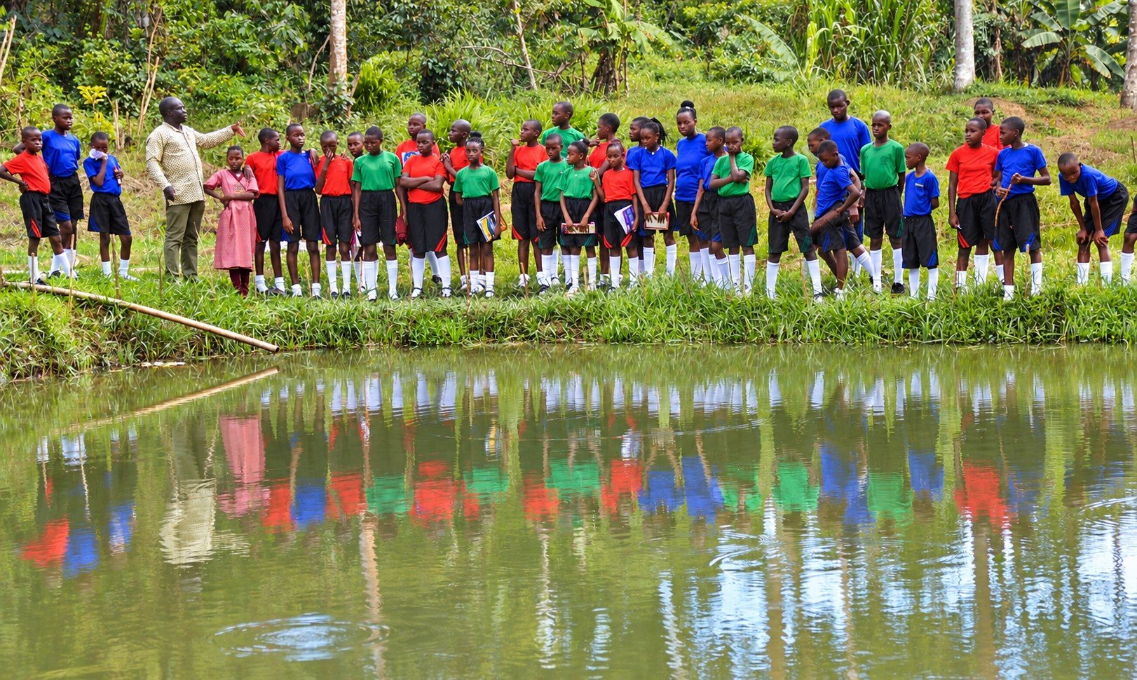 Schoolchildren Exploring a Reflective Pond.jpg