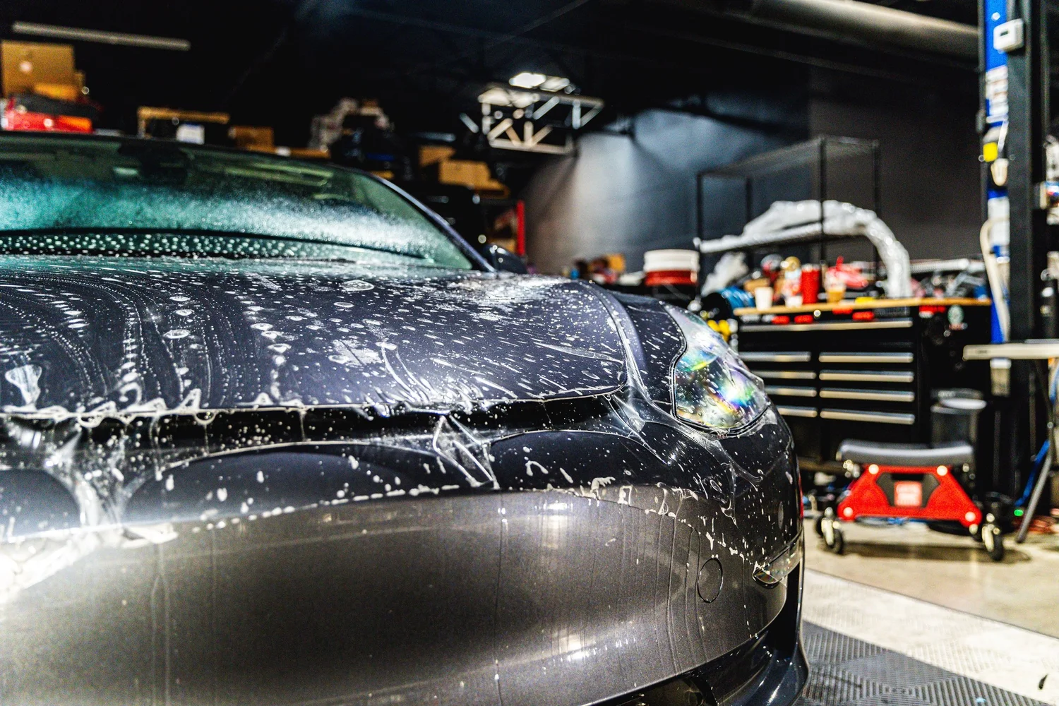 Water beading on a freshly ceramic coated car in the Chino shop