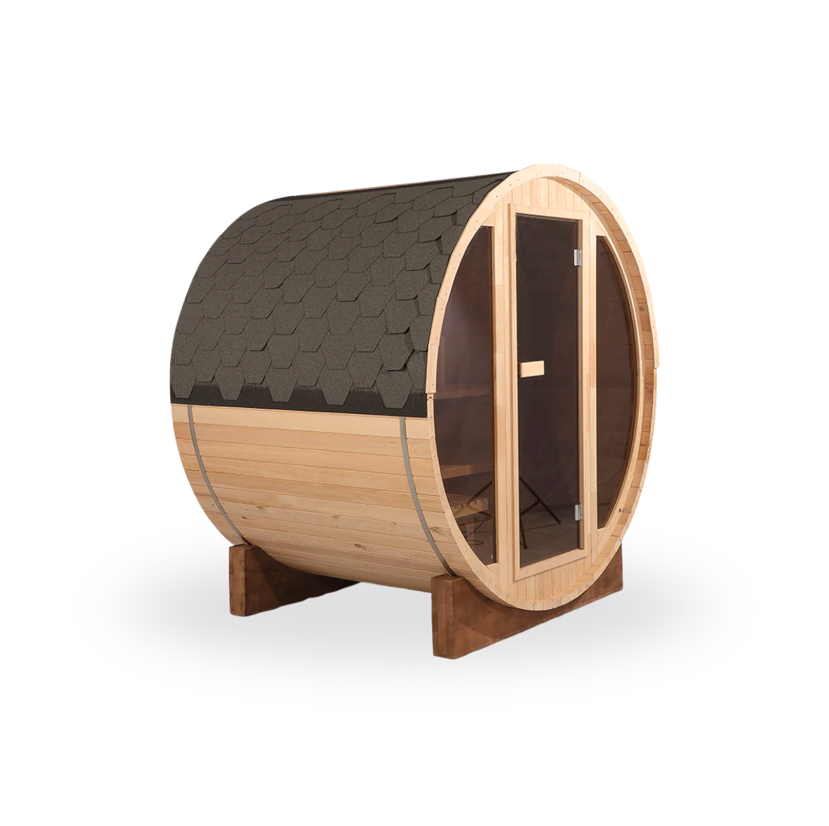 A small wooden barrel-shaped sauna with a glass door and a shingled roof, elevated on wooden supports.