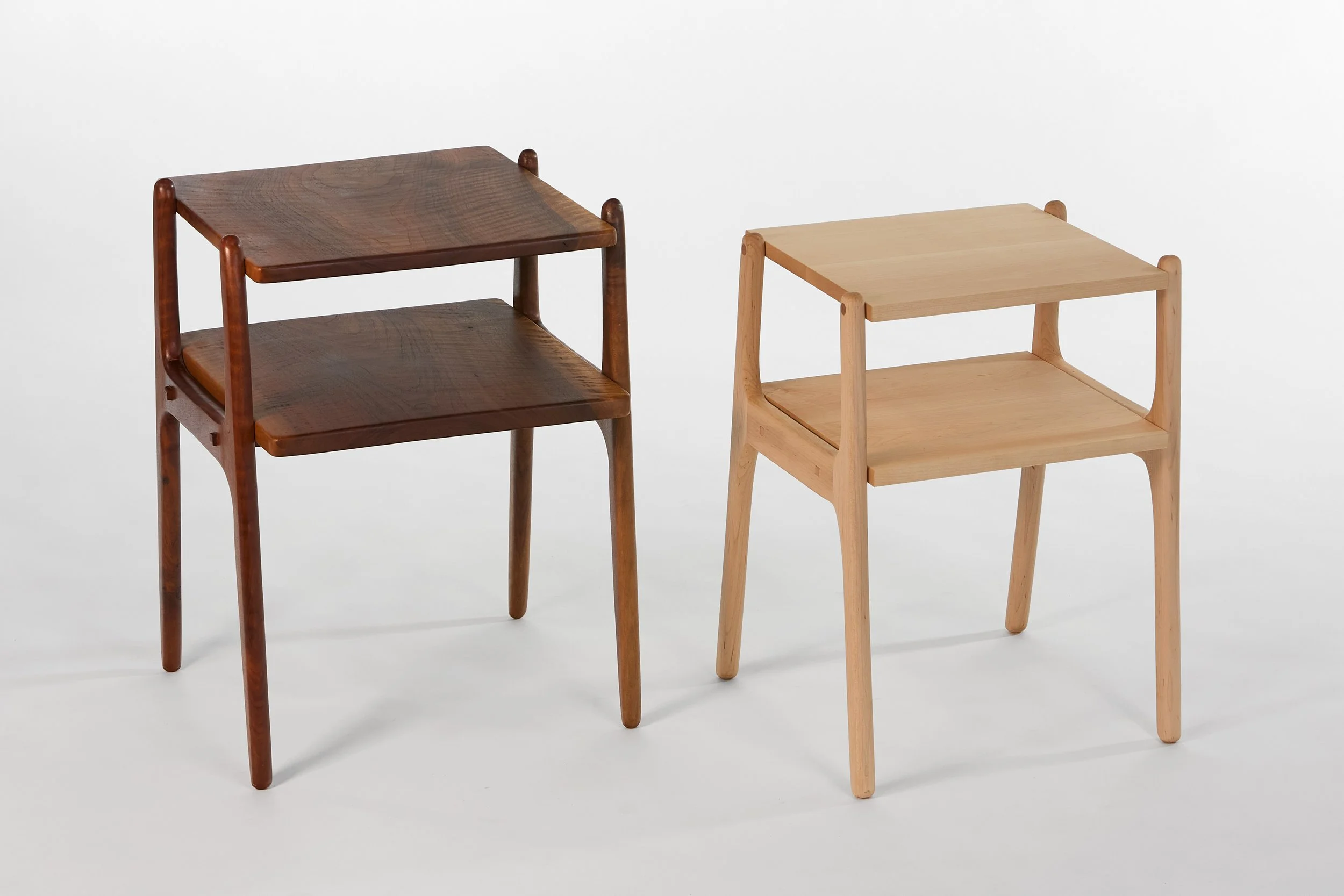 Two-tiered tables in solid Claro Walnut and solid Hard Maple.   Through-tenon joinery.