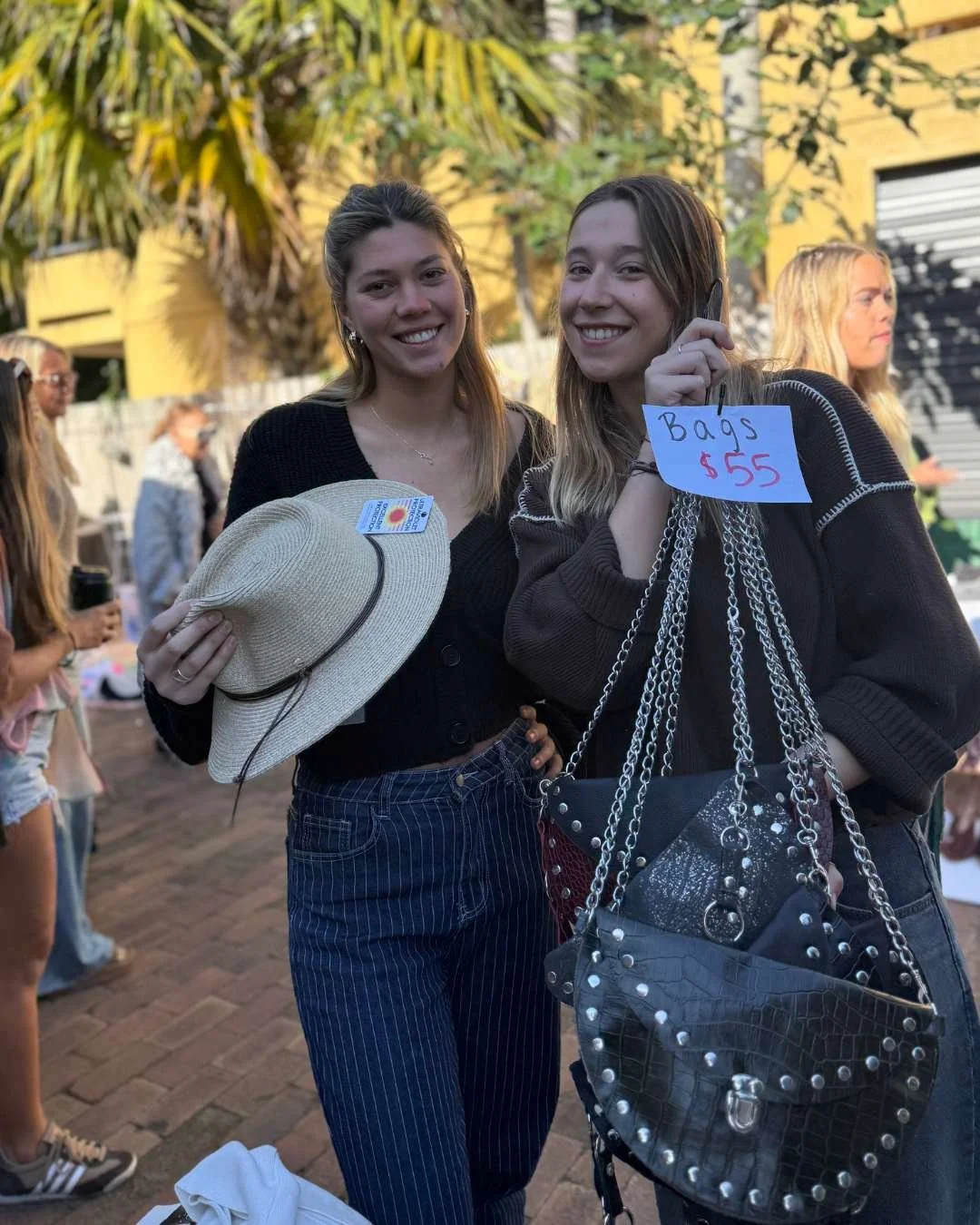 Two girls selling bags at the thrift market at Perk Up Byron Roadhouse Byron Bay