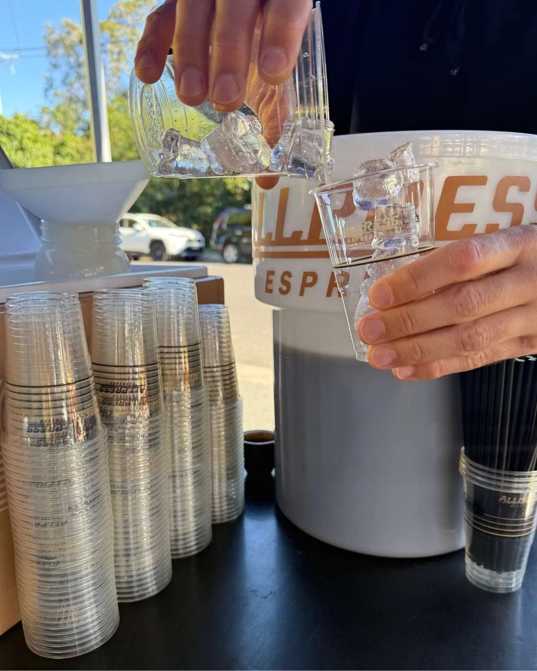 Allpress coffee station pouring ice from one cup to another
