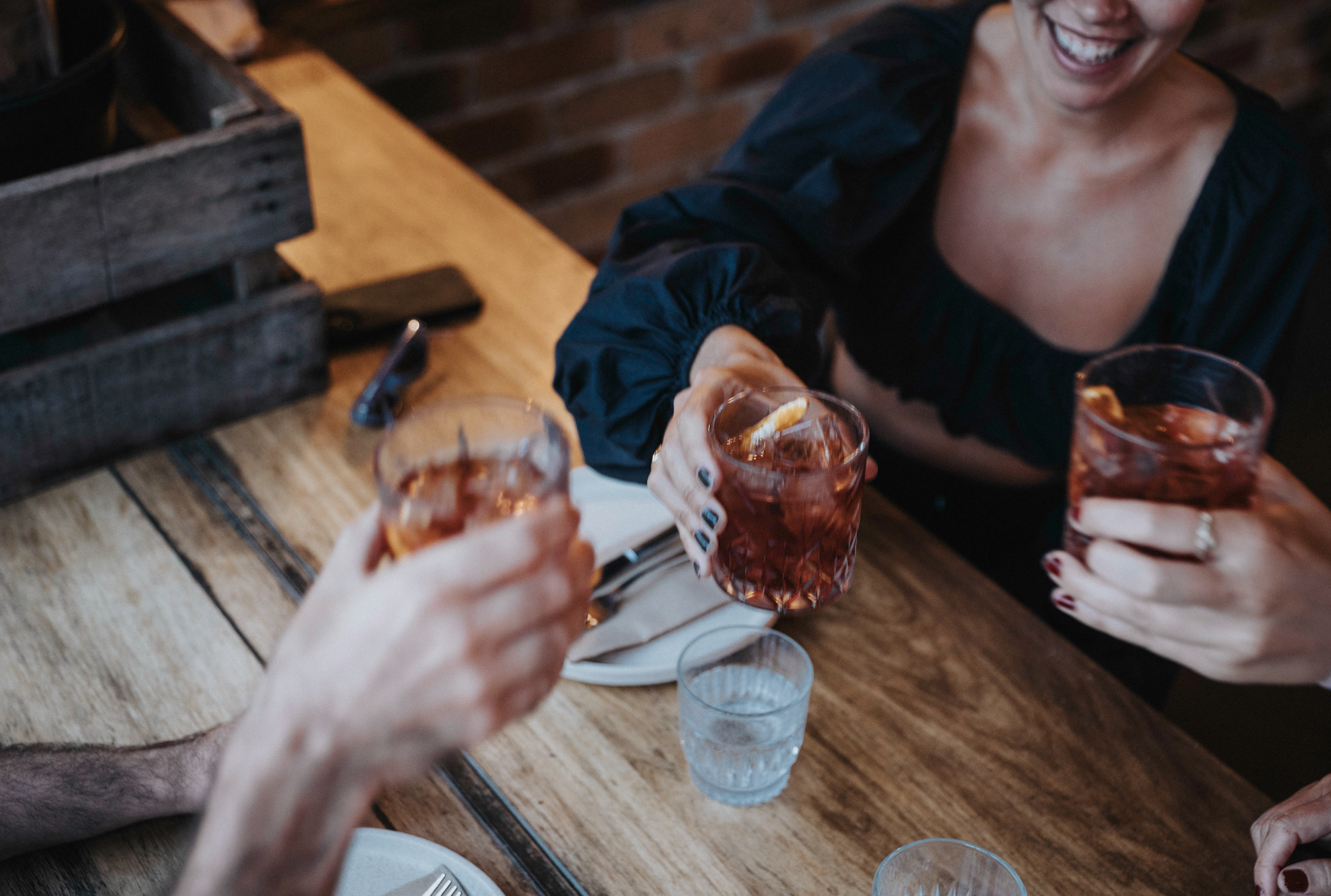 Ther Roadhouse Byron Bay Happy Hour 5-6 PM People drinking negronis at a table