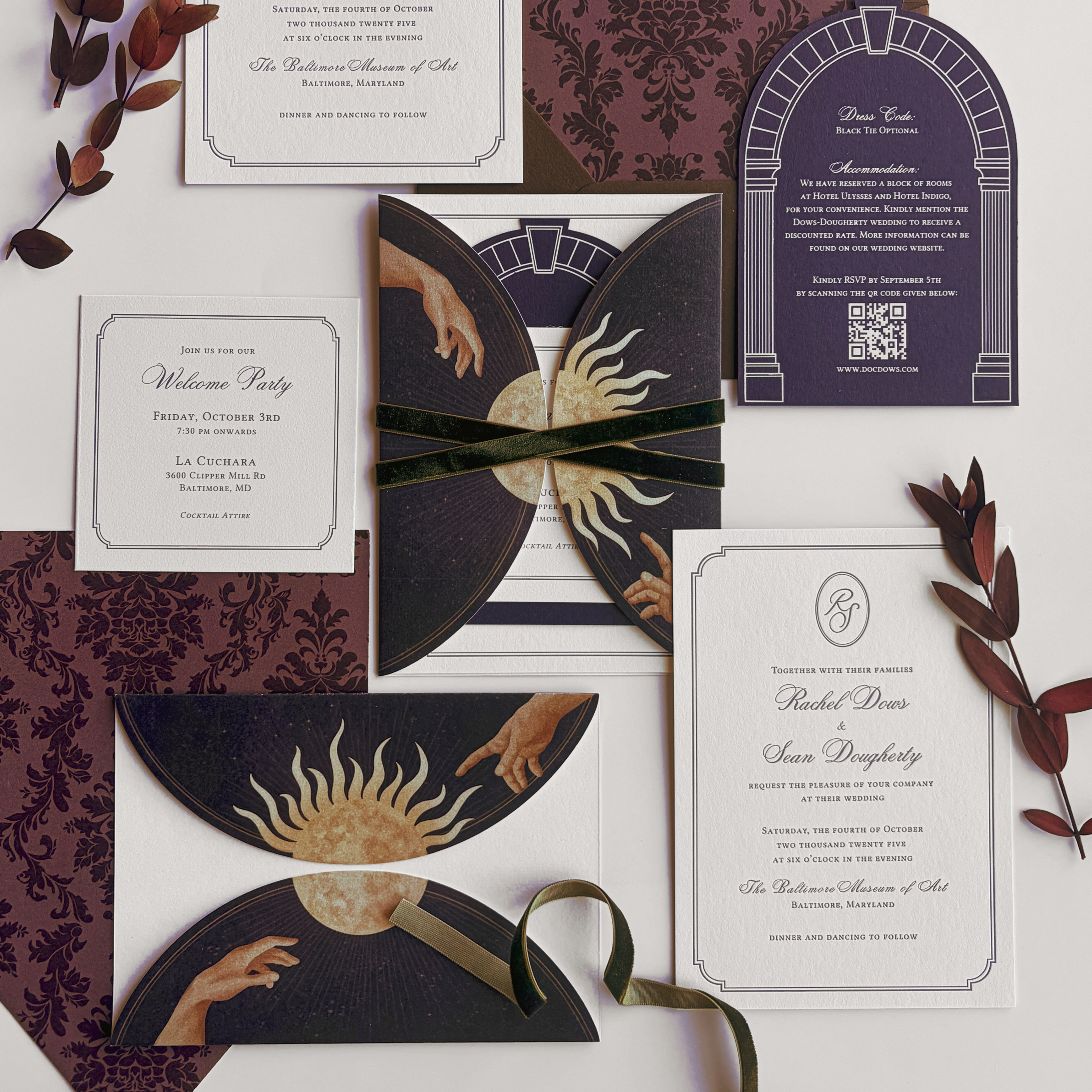 A flat lay of wedding and event invitation cards, a pocket sleeve featuring a hand-drawn sun and moon illustration, ivory cards with purple letterpress ink and an arch-shaped die-cut with white foil printing.
