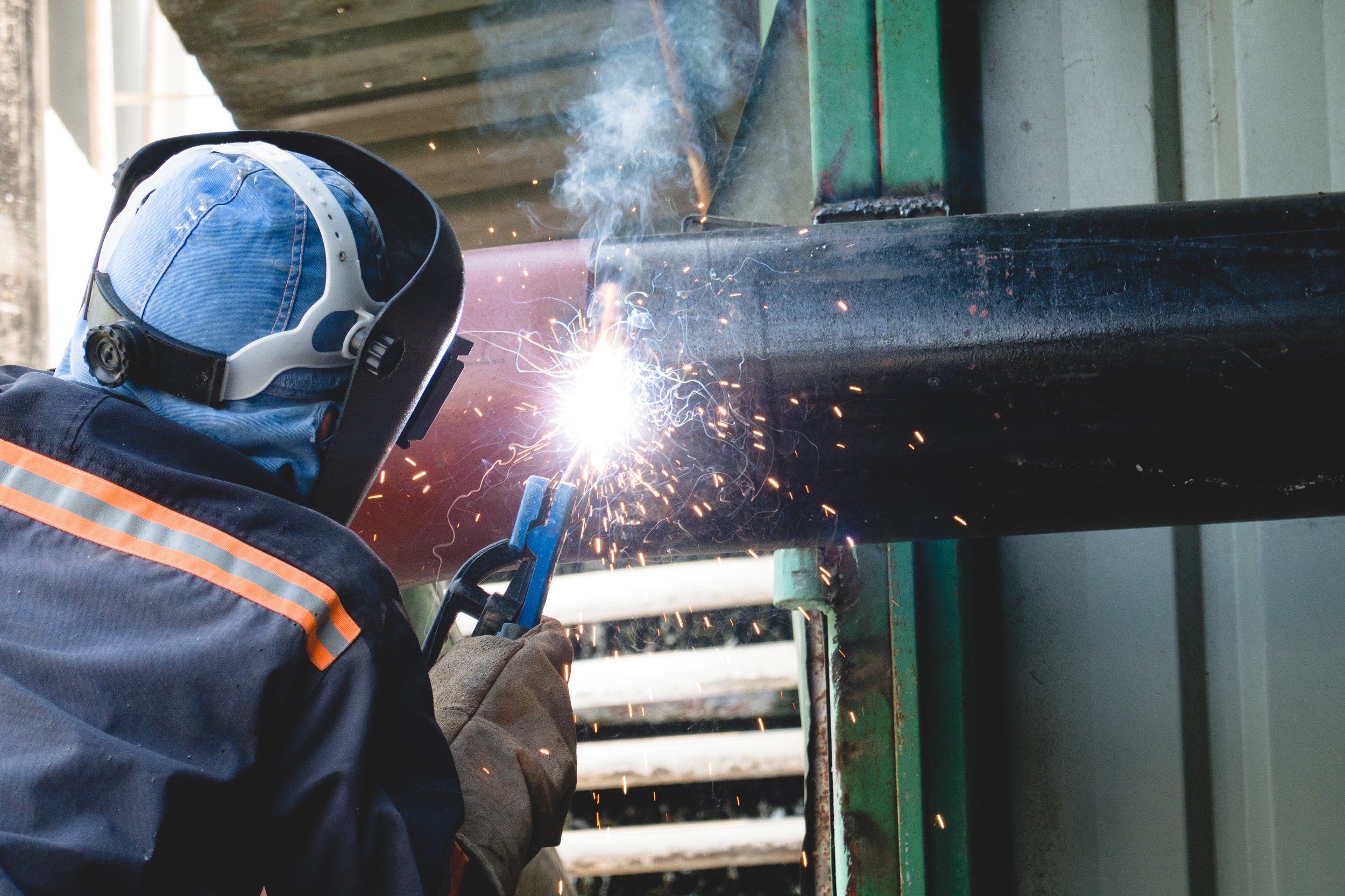 a-welder-is-welding-a-water-pipe-system-in-an-indu-2024-10-20-09-46-33-utc.jpg