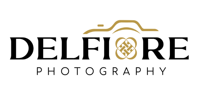 Logo for Delfore Photography featuring a stylized camera outline, with the company name in black and gold.