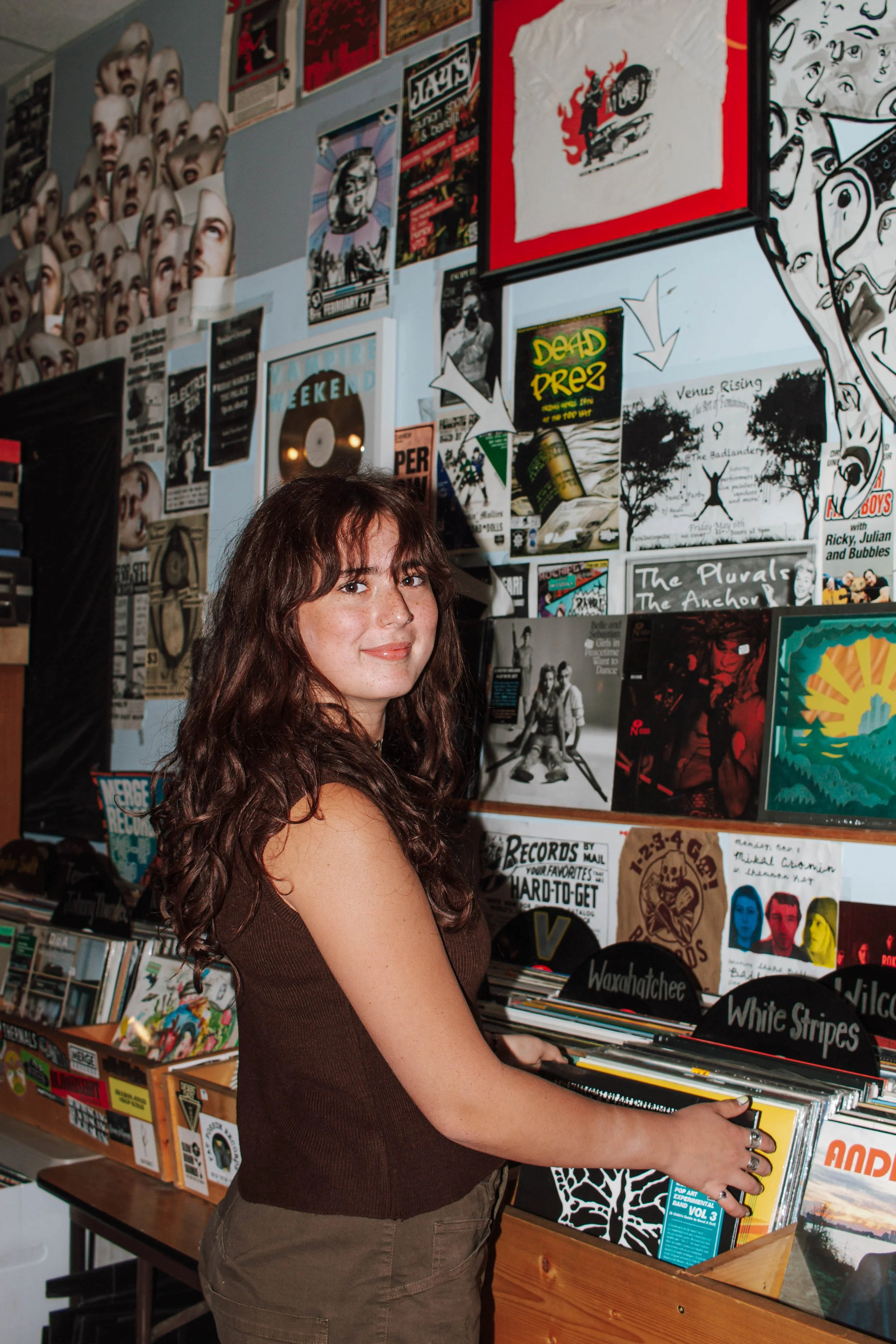 girl shuffles through vinyls at a missoula record store