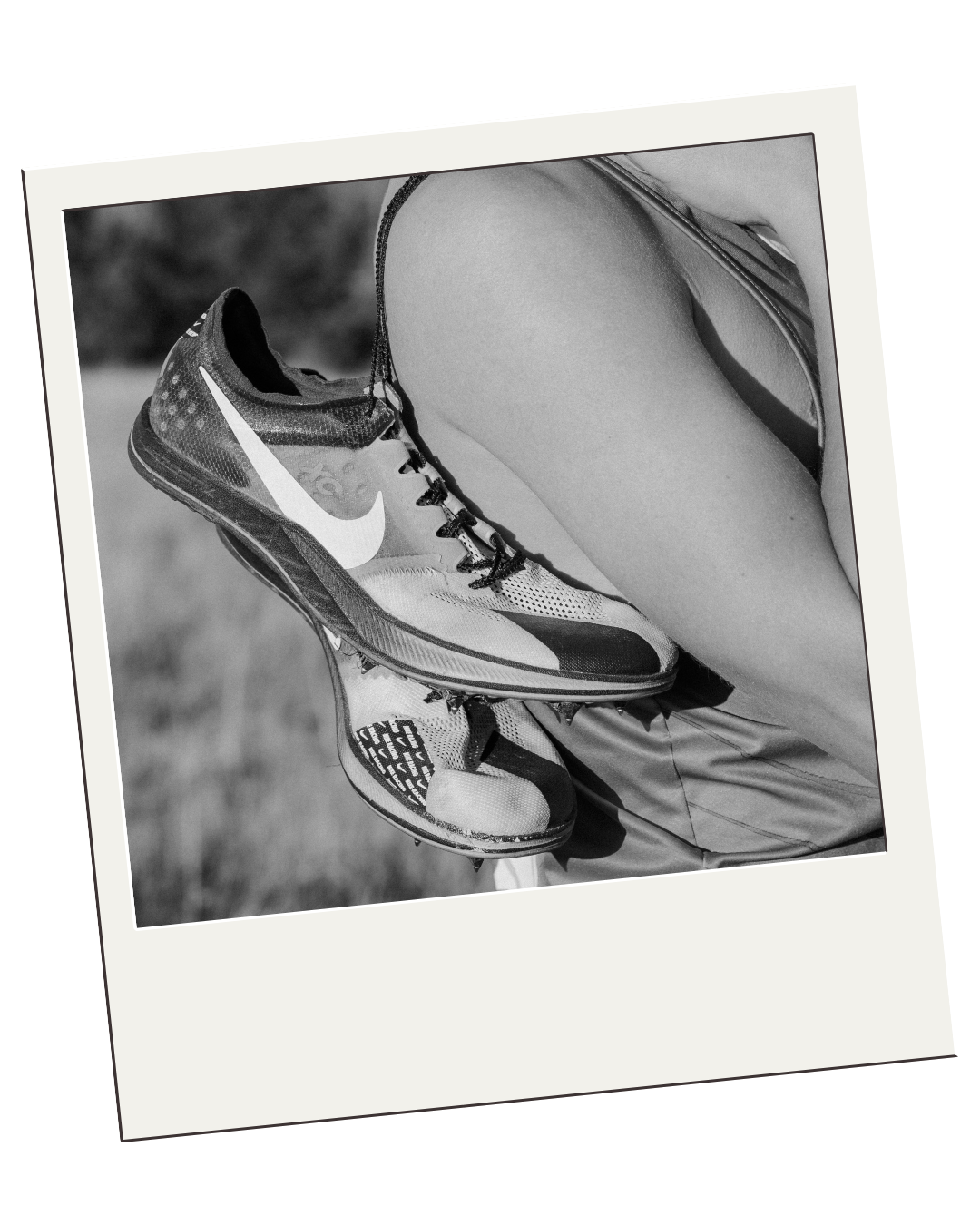 track cleats over senior boys shoulder