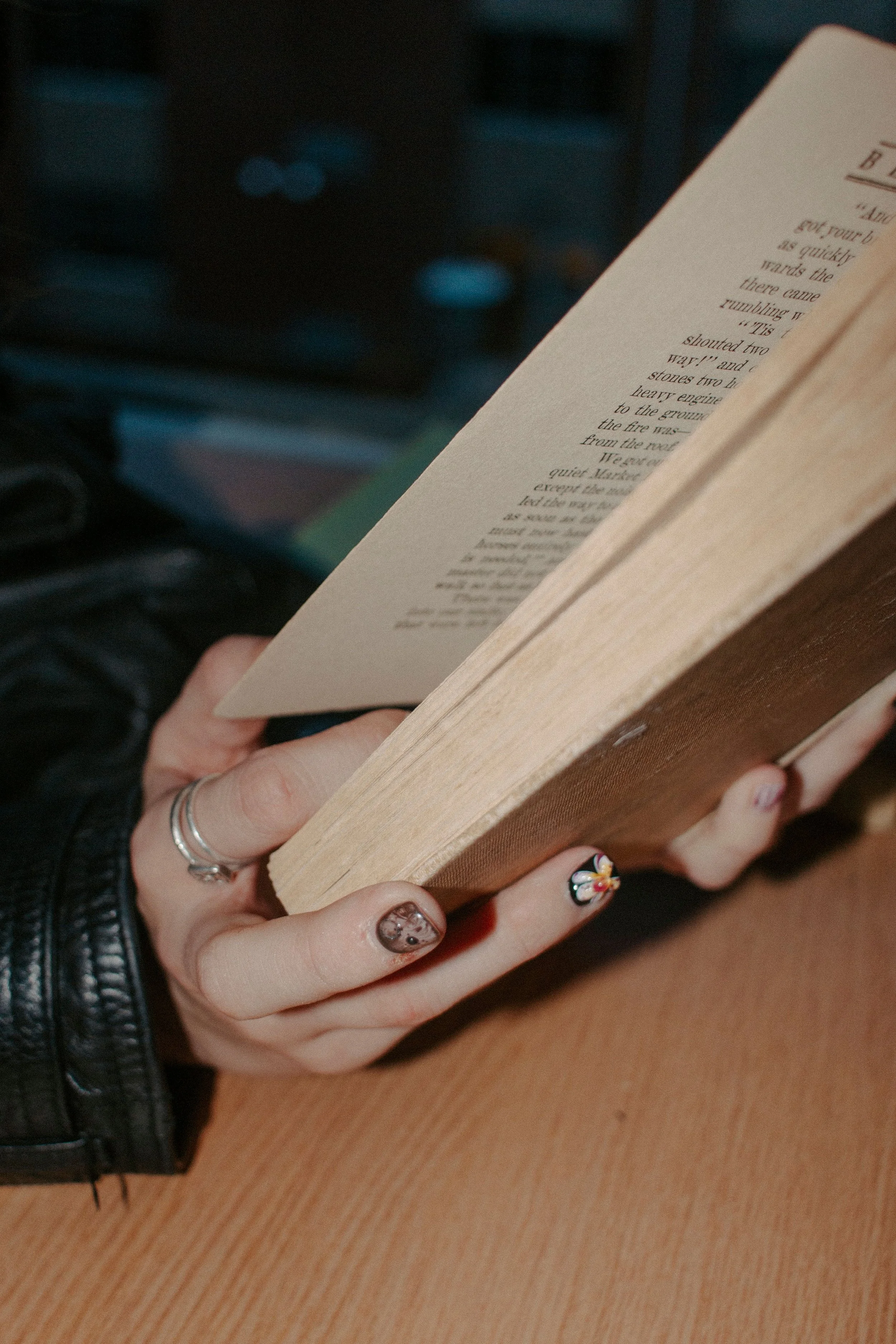 girl flips through book pages