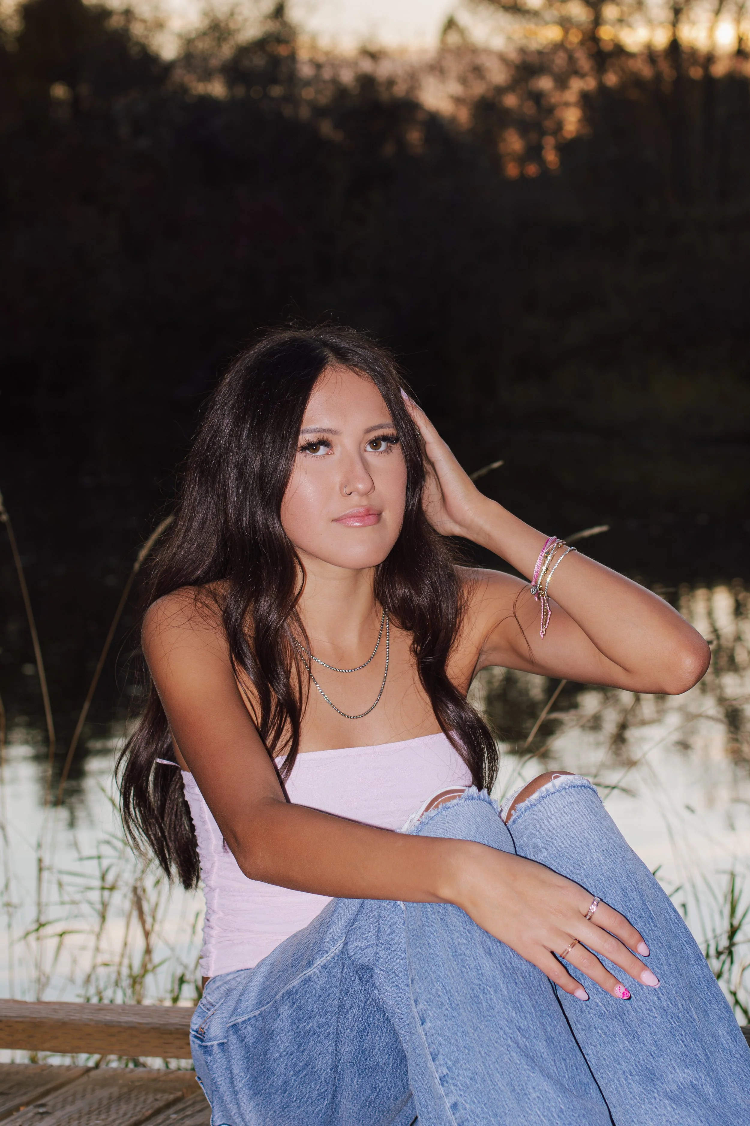 senior sitting with hand in hair