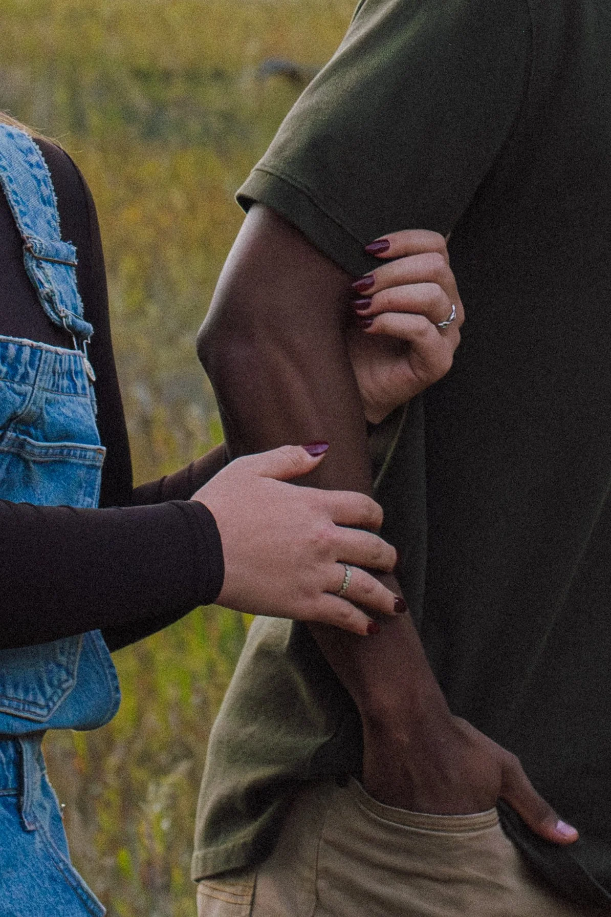 girl going to grab boyfriends arm