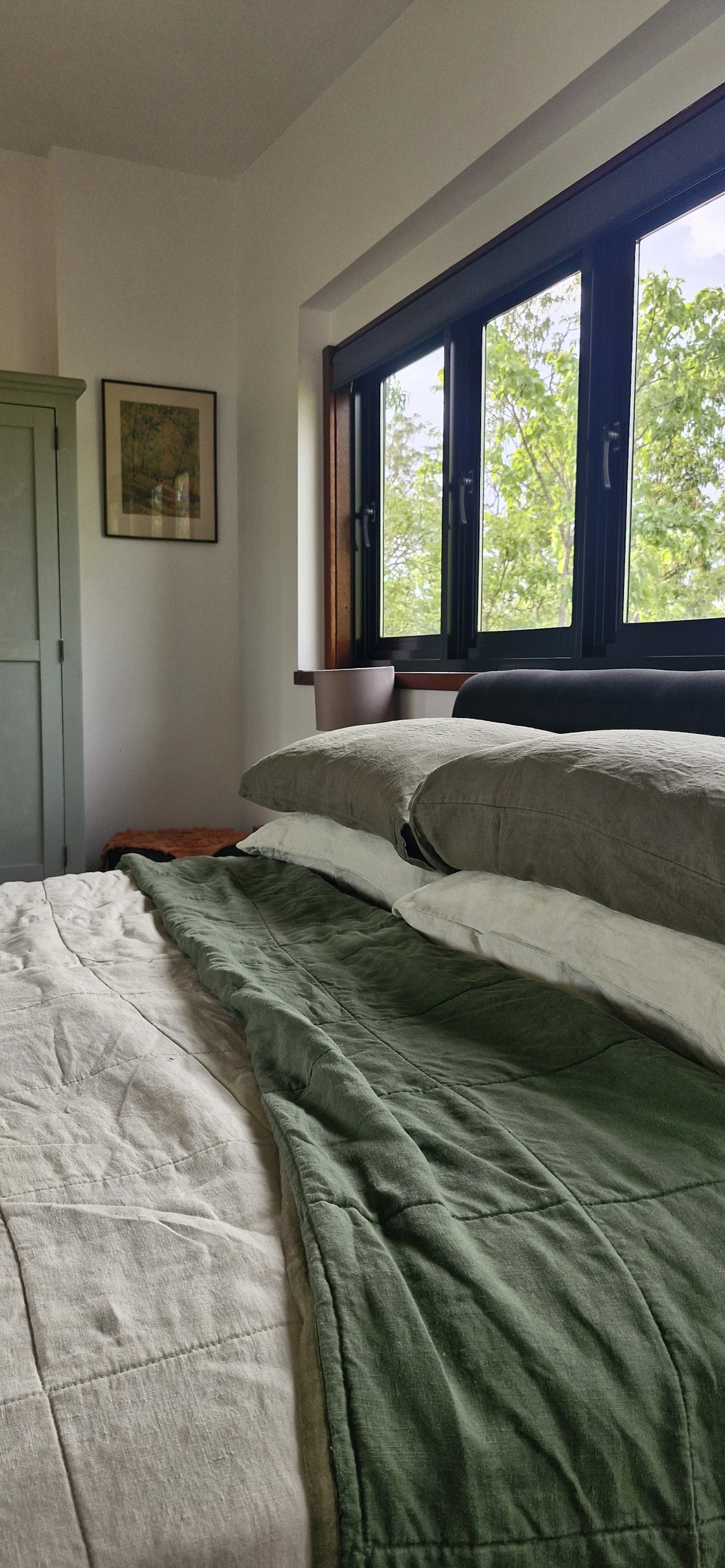 View across the queen size bed and french linen sheets