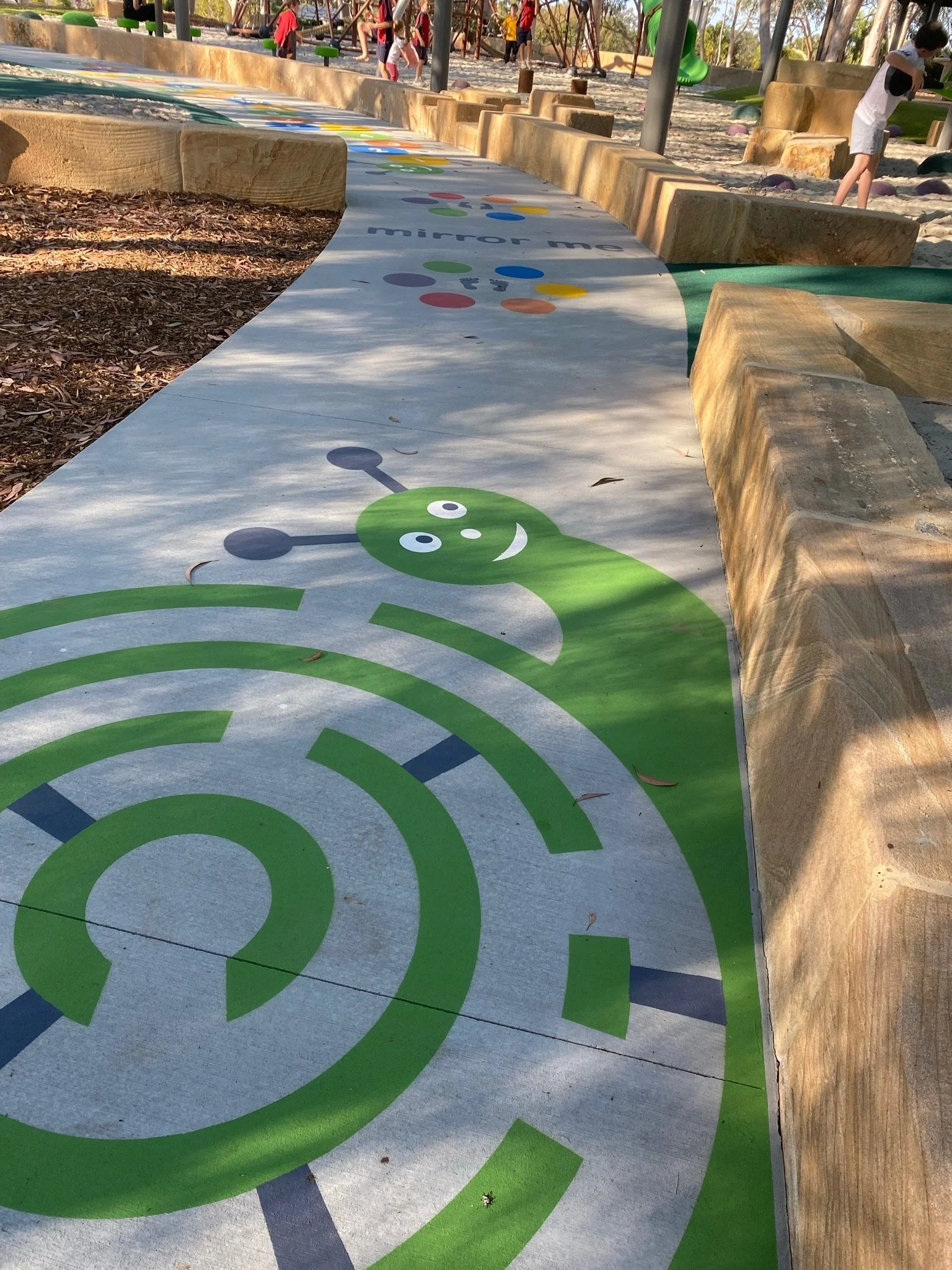 Inclusive and safe play environment with soft fall surfaces at Hanover Drive Park

