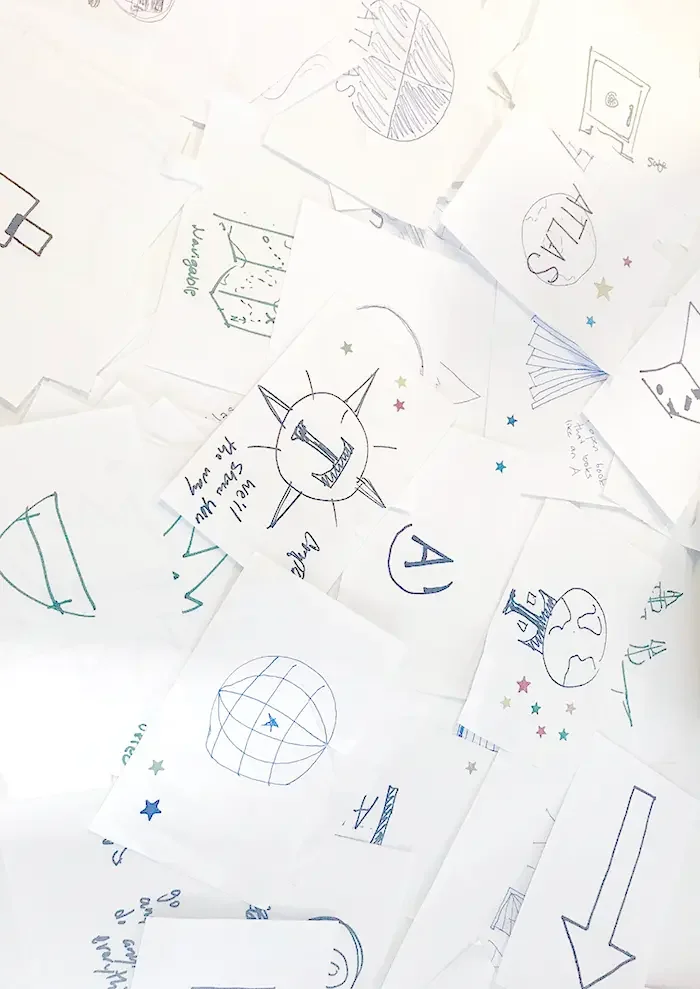 group of a peices of paper with logo drawings.