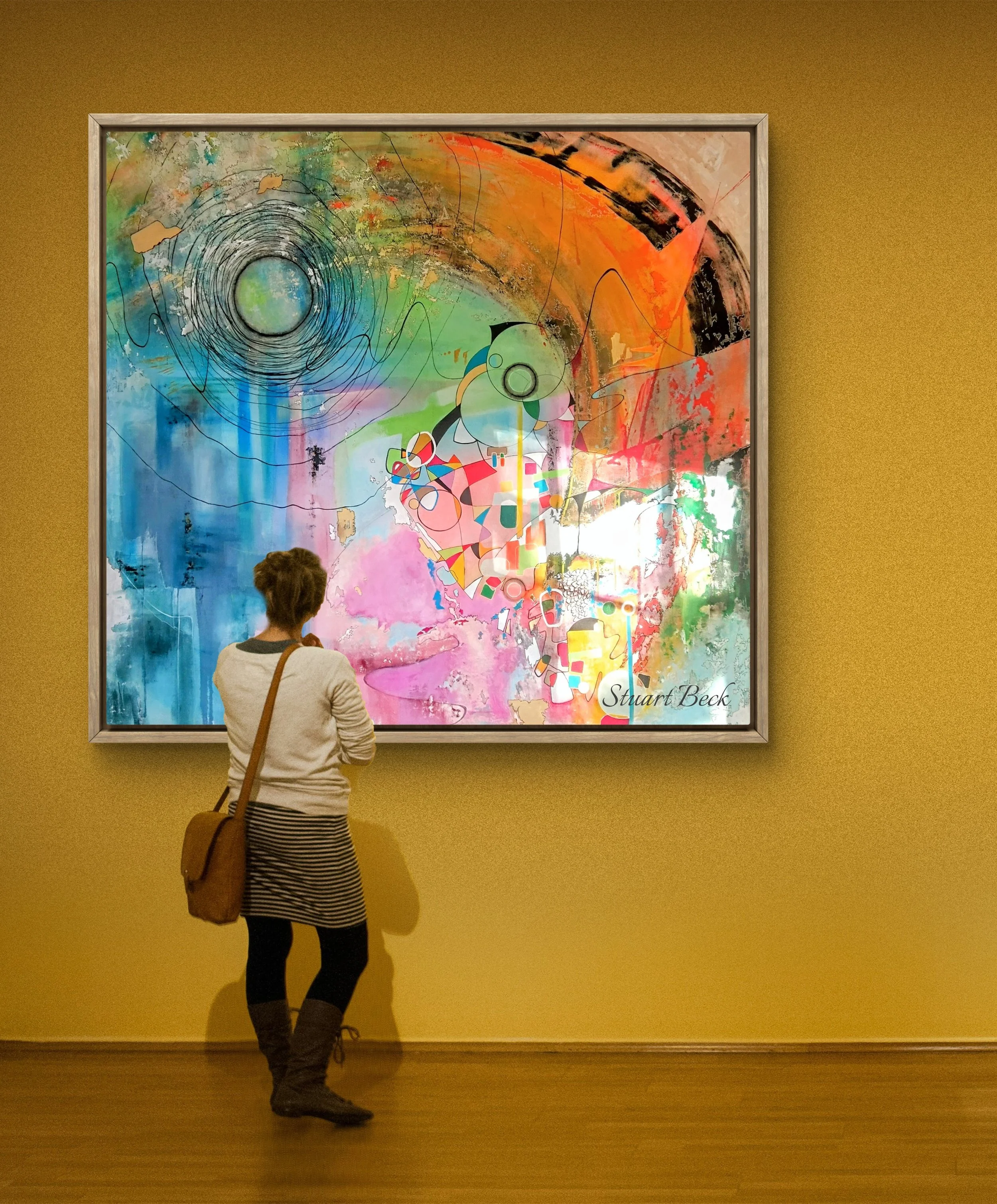A person viewing an abstract colorful painting in an art gallery.