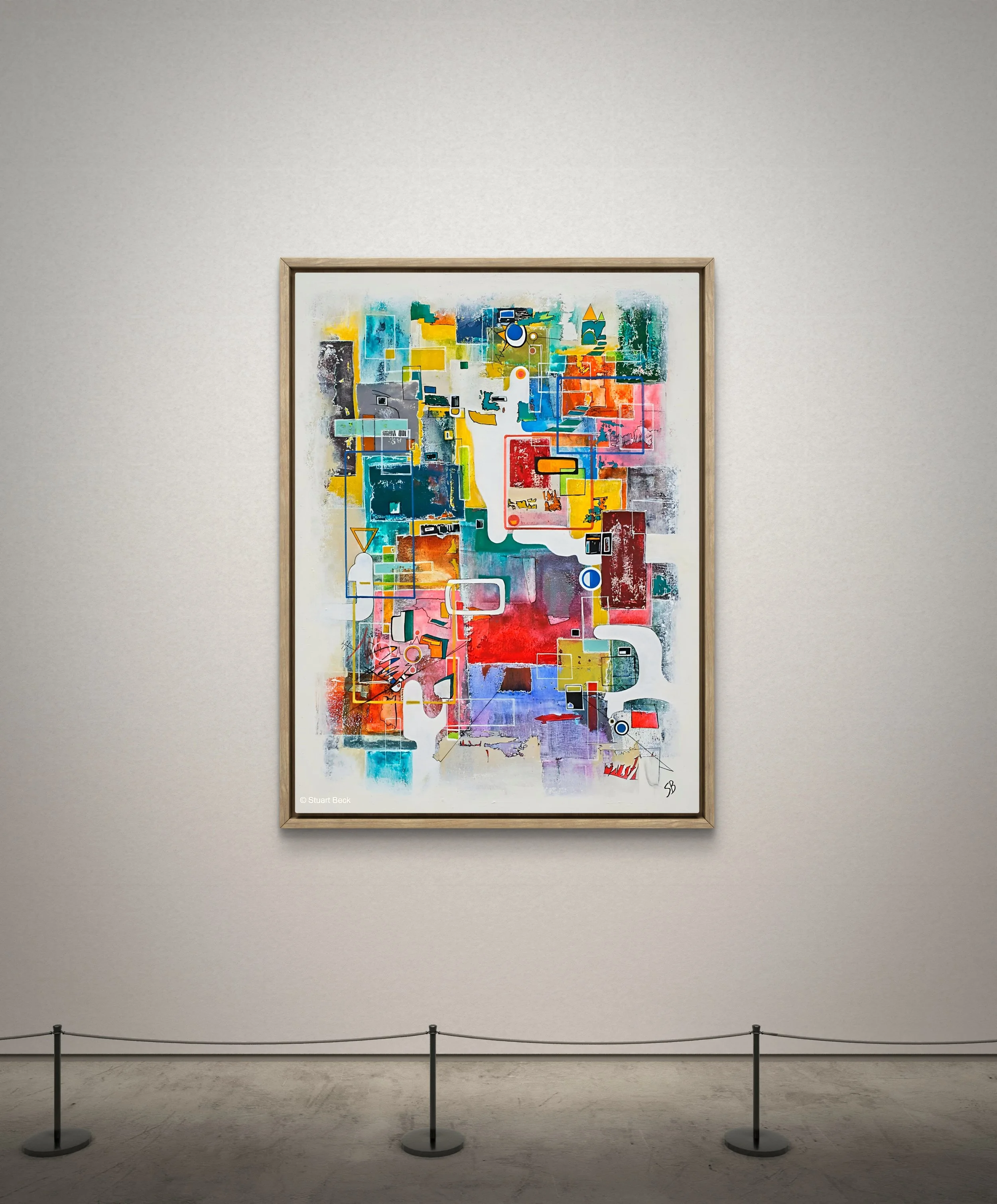 Colorful abstract artwork framed and displayed on a gallery wall with a stanchion barrier in front.