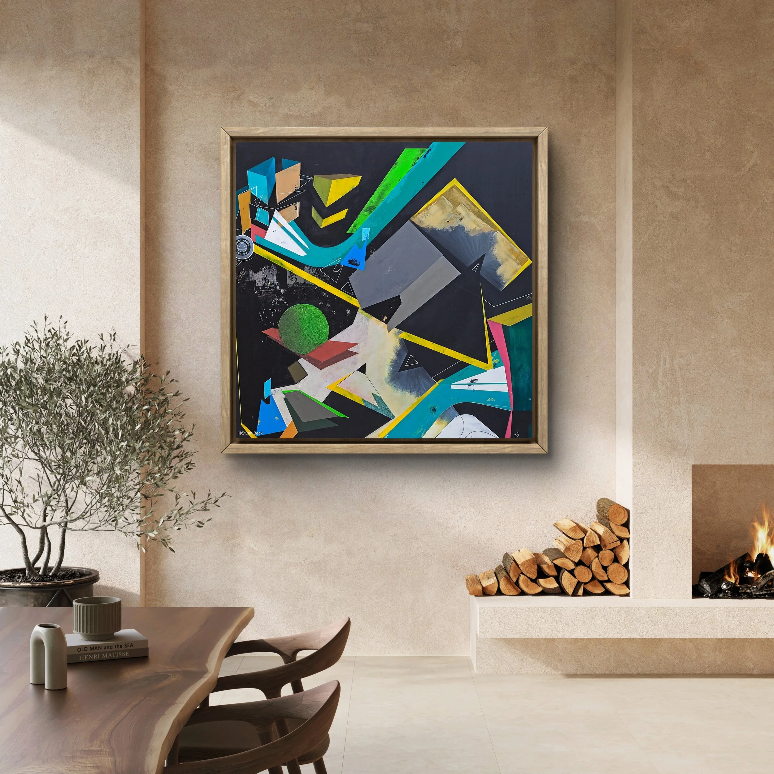 Modern living room with an abstract painting on the wall, a stack of firewood next to a fireplace, and a wooden dining table with decorative vases and a book.