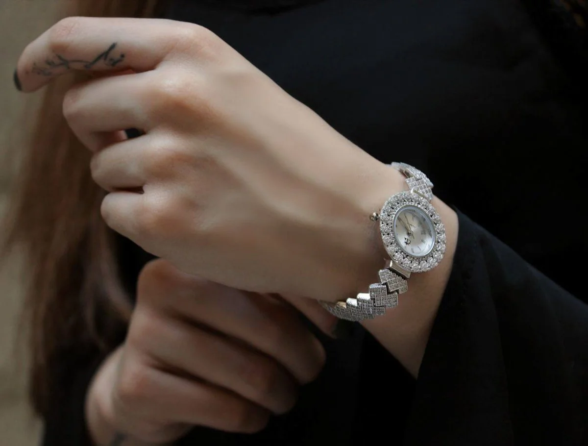 Artistic depiction of a watch with gemstones, captured in perfect light and shadow.