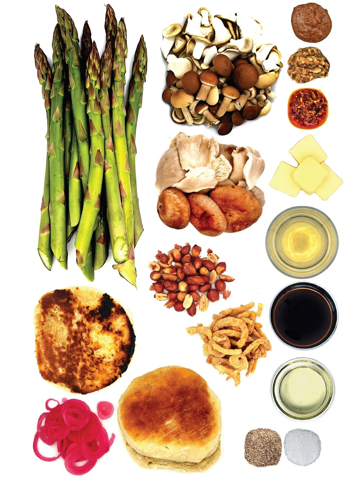 Ingredients including fresh asparagus, assorted mushrooms, ground beef, cheese, chopped peanuts, fried onions, pickled red onions, burger bun, burger patty, condiments, and seasonings.