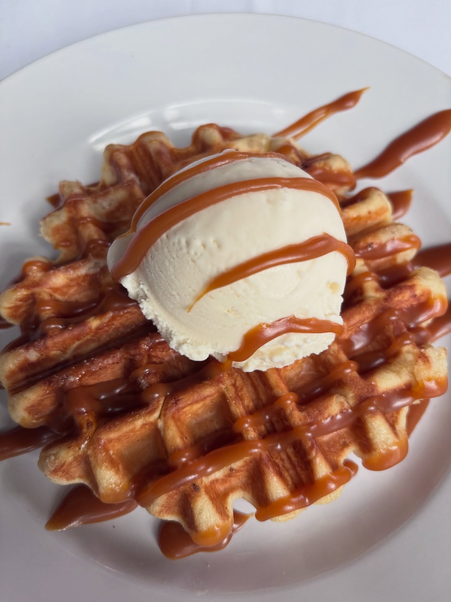 Now serving our new dessert!!

Try our housemade li&eacute;ge waffle and ice cream! Made from a brioche-like yeast dough studded with pearl sugar. A perfectly sweet way to end your meal!