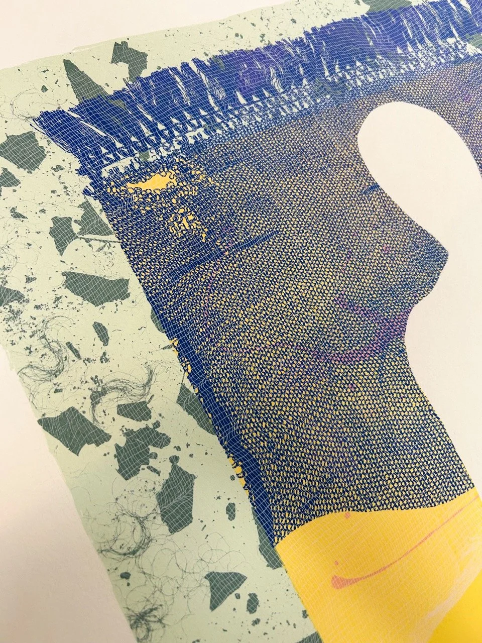 Close-up of a part of an artwork or print depicting a hand with detailed lines and patterns, with patterned and splattered background elements.