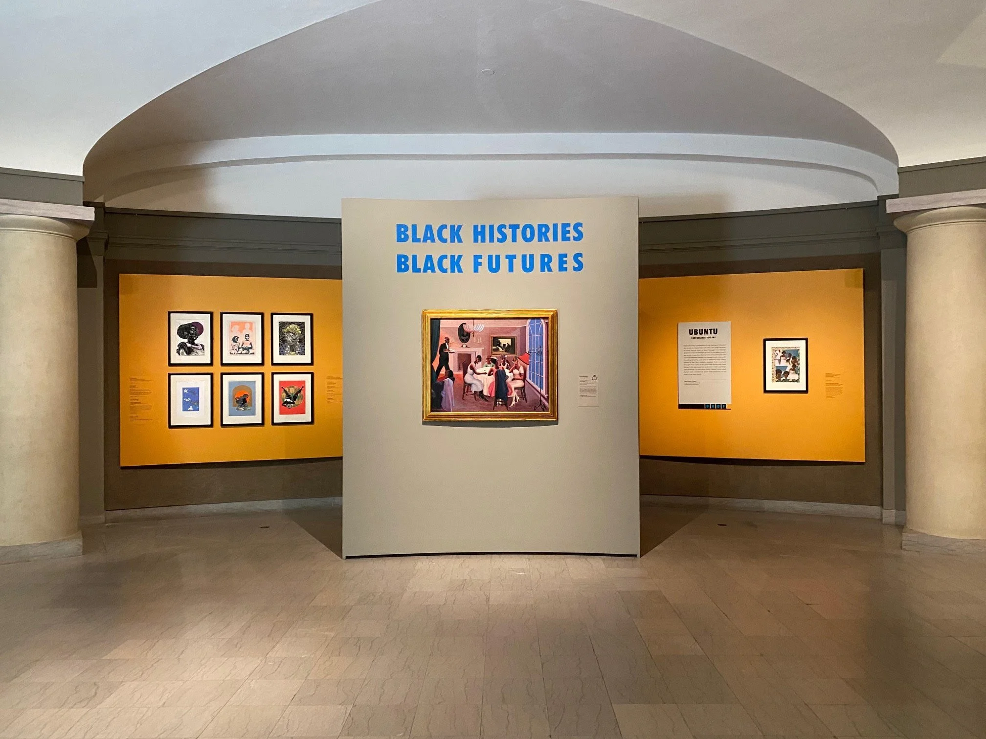 Exhibition display titled 'Black Histories, Black Futures' with framed artworks on yellow background walls in a museum setting.