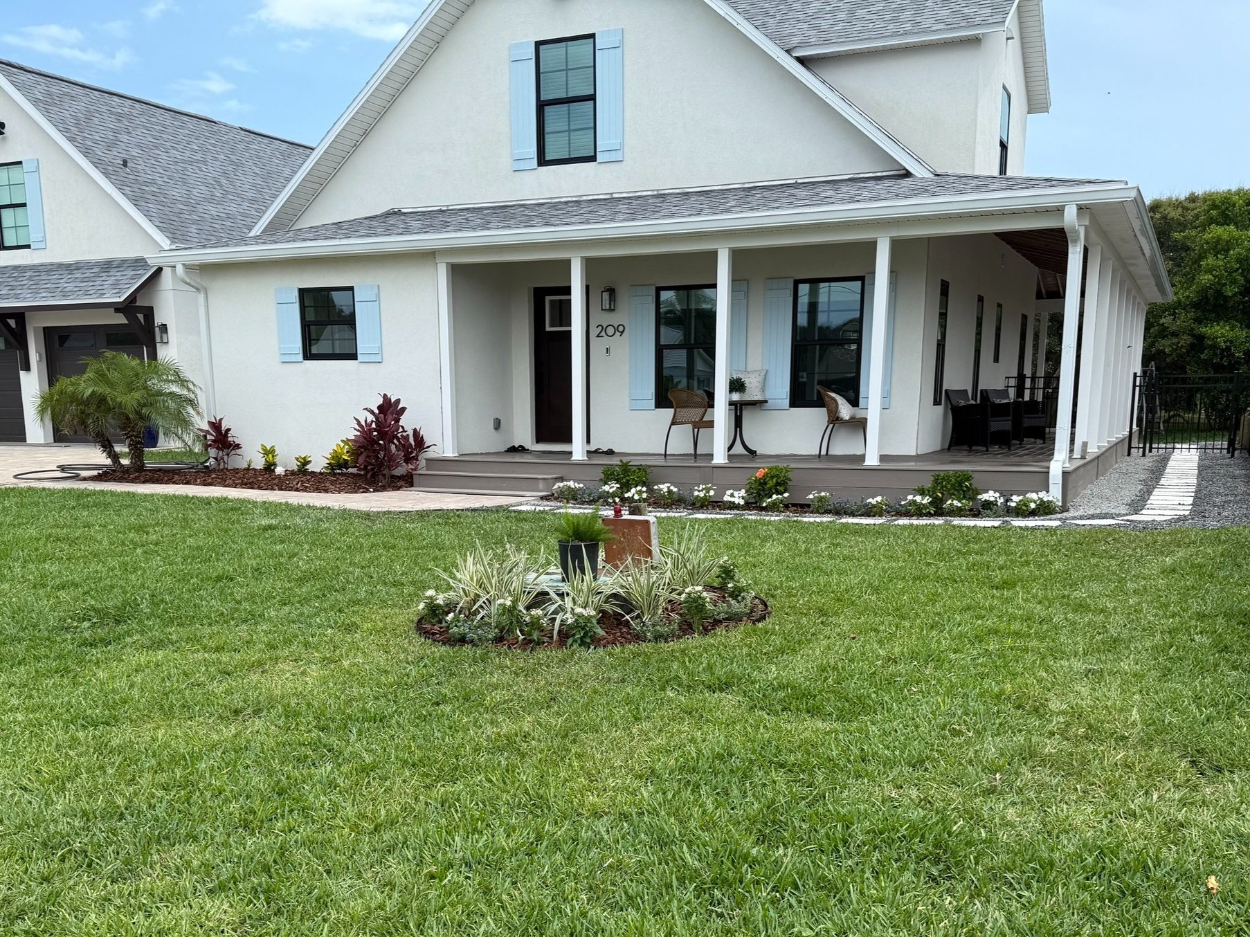 Bed re-design and installation with a stone and paver walkway