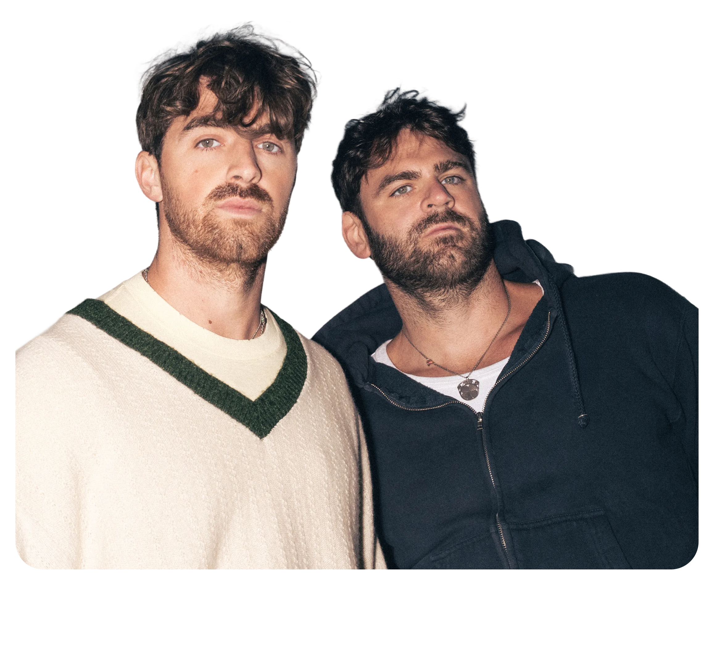 Two men with dark hair and beards standing close together against a white background, with text "FLETCHER" partially visible at the bottom.