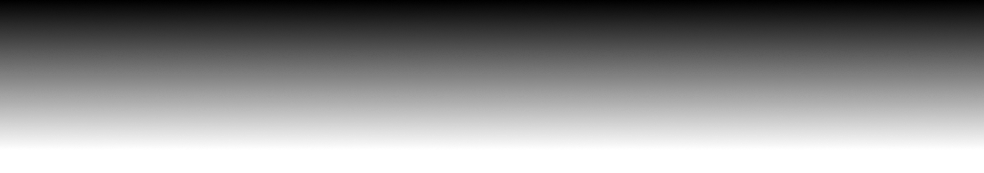 The horizon during sunset with a bright orange sky and the silhouette of trees in the distance.