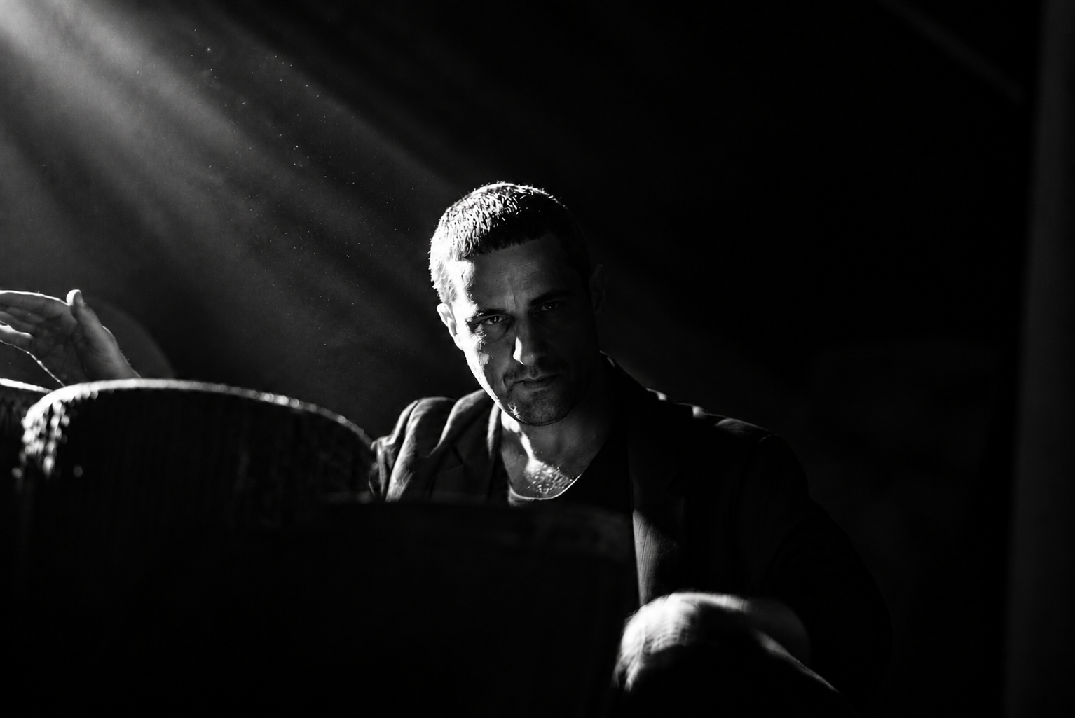 Fjokra playing drums in black and white