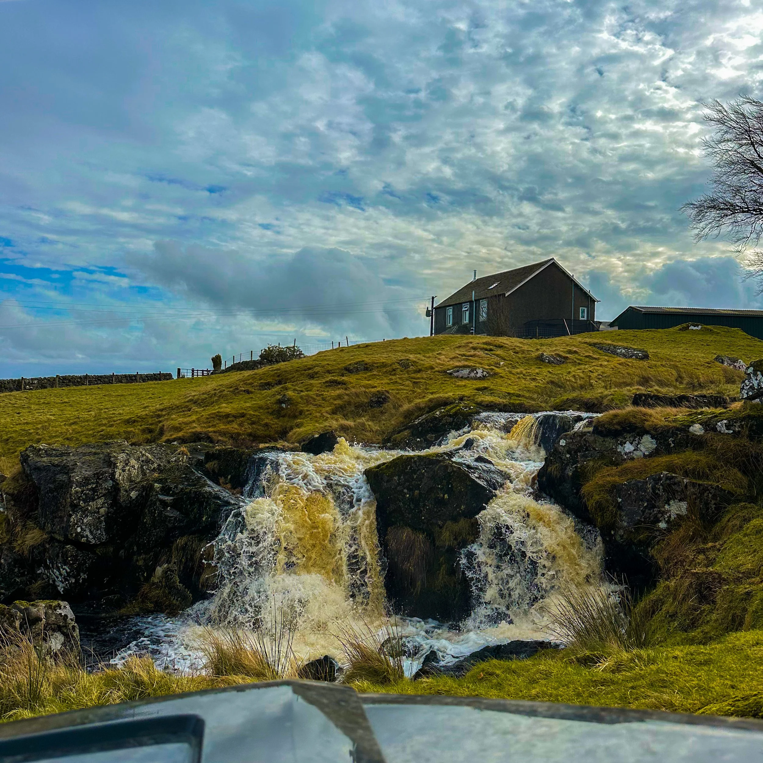 Countryside views on a Scottish hill farm visited during the Highland cow farm experience from Greenock Cruise Port