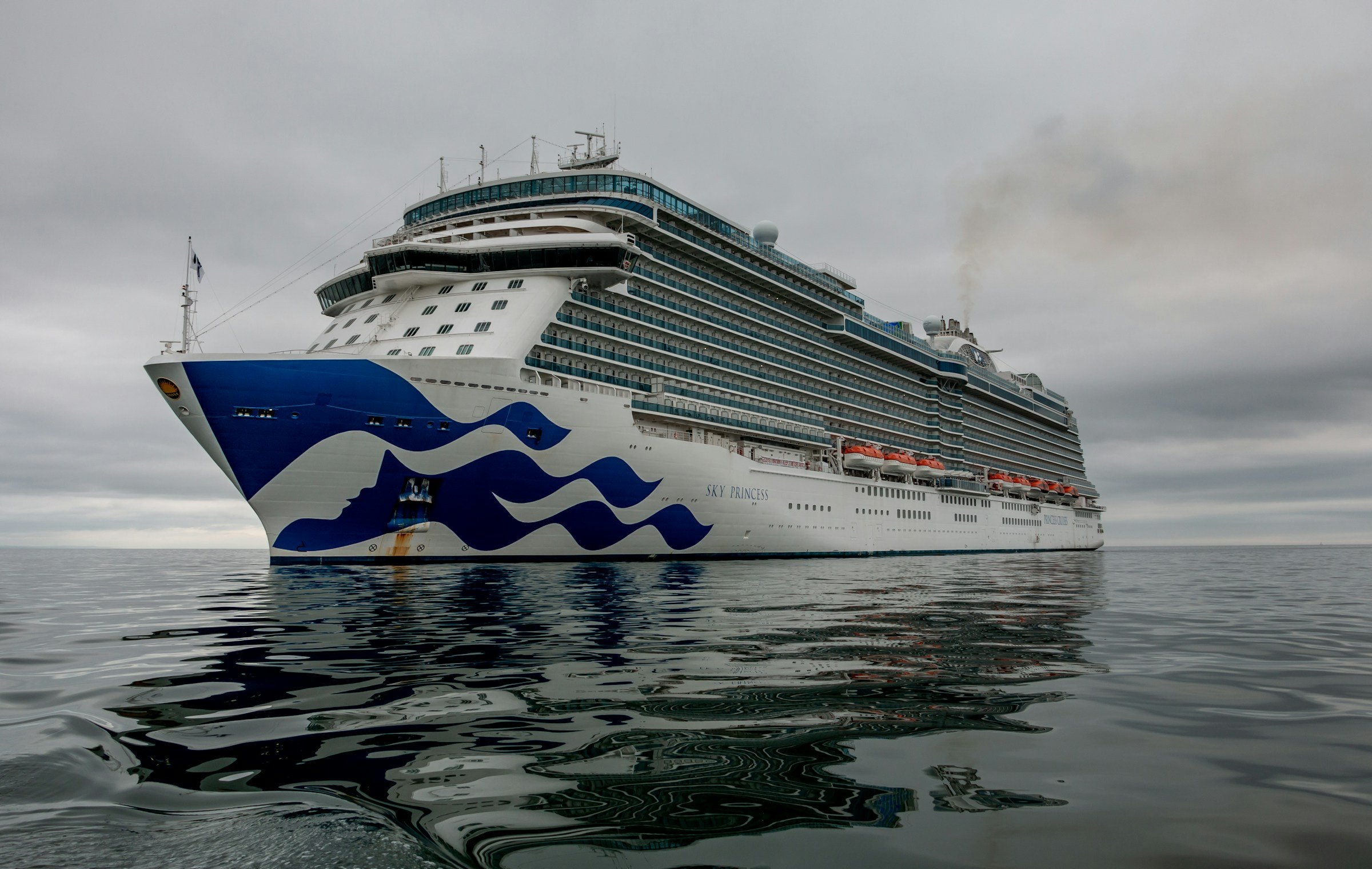 Princess cruise ship anchored offshore during a British Isles cruise, where passengers may use Water Shuttles to travel ashore.