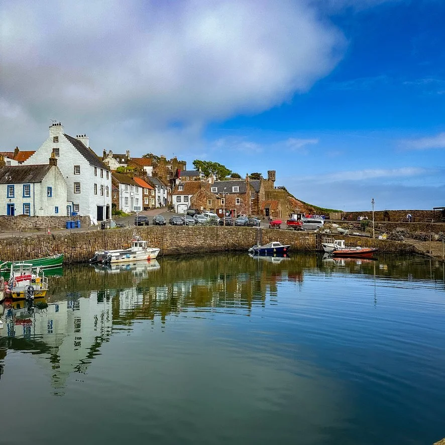 Coastal fishing village with small boats in the harbour