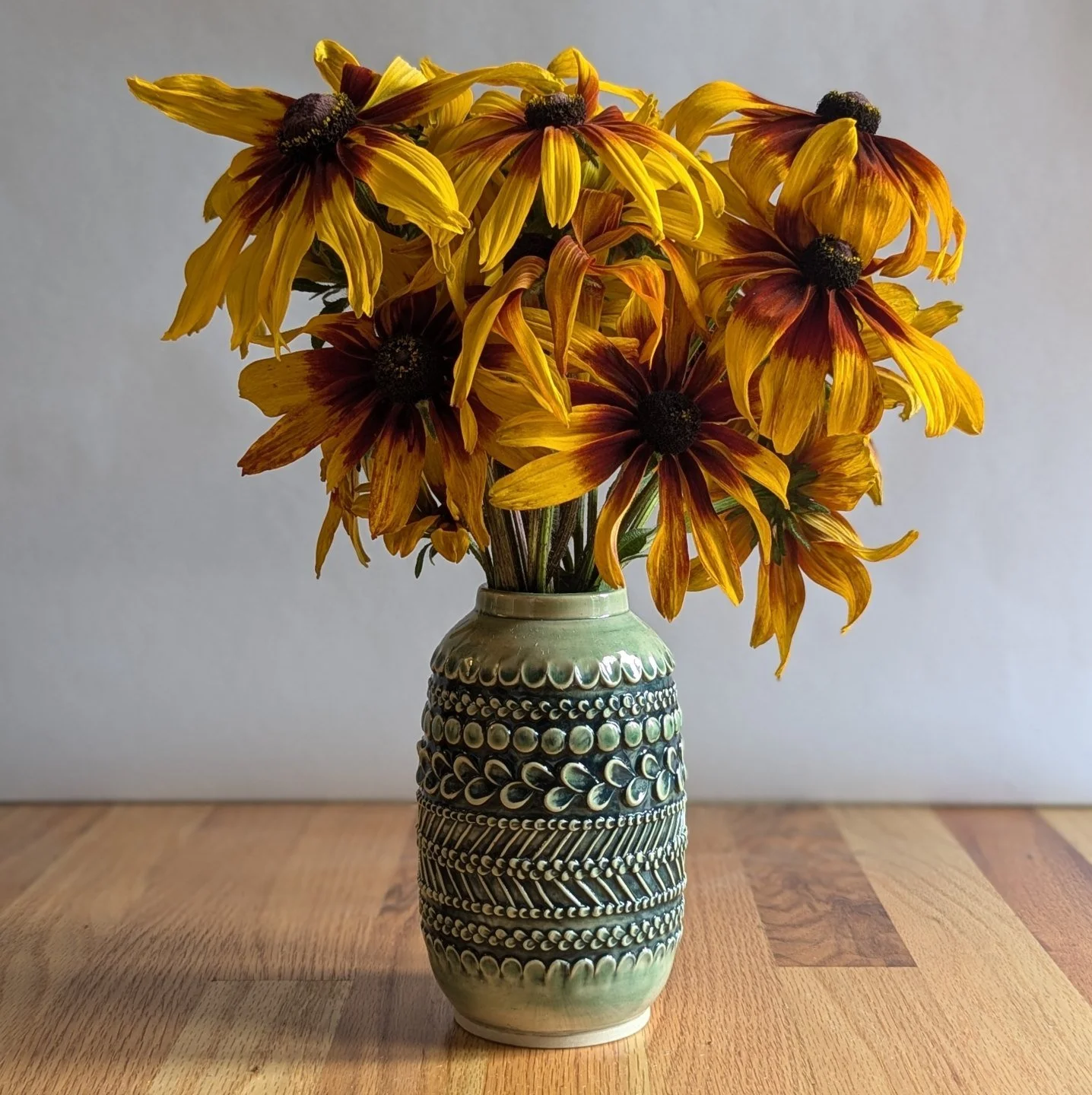 A piped vase from the summer with the last flower grab before the freeze.