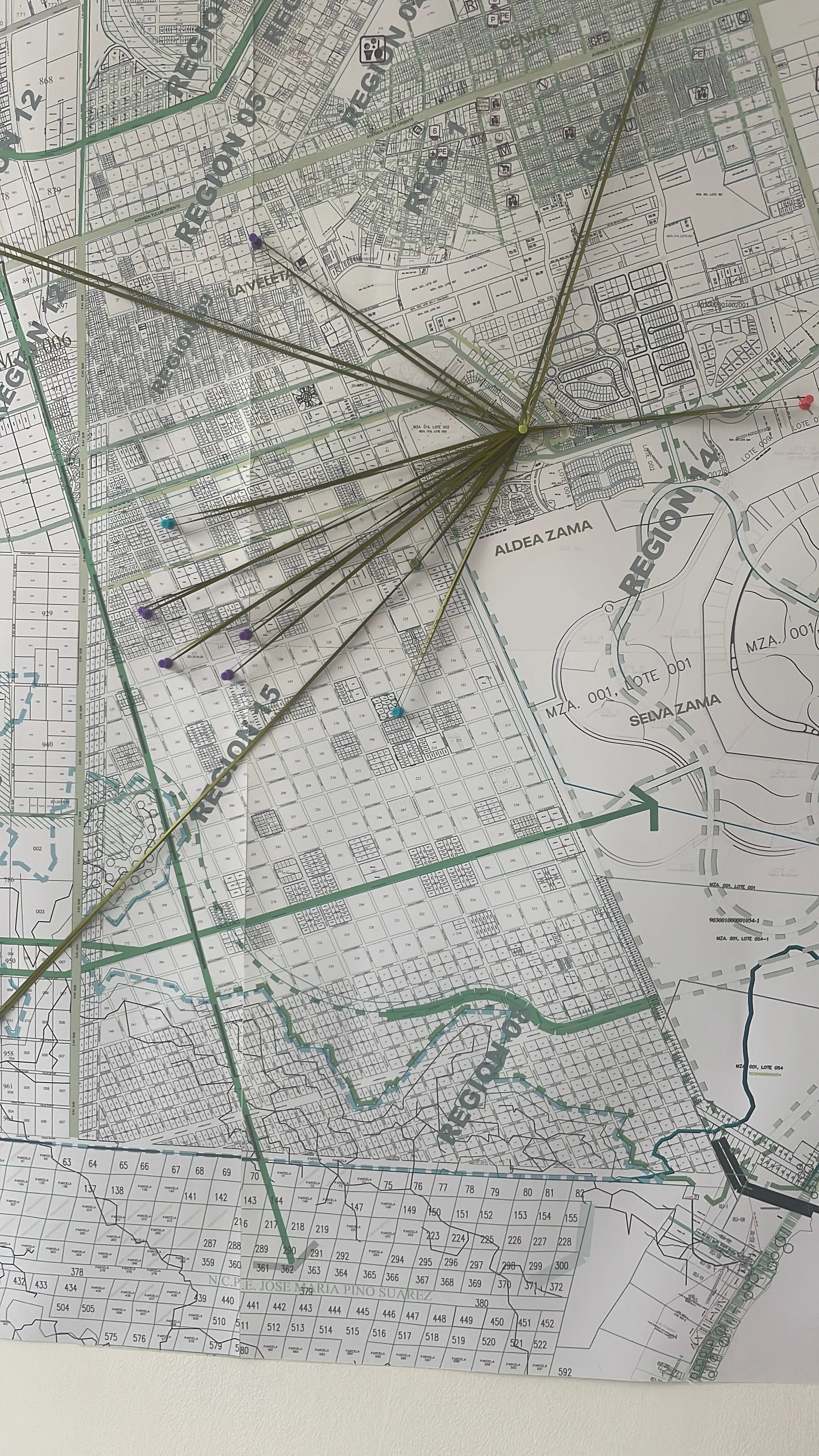 A map of Tulum with multiple colored pins and strings indicating various locations and directions. Hypha Inc. Clients