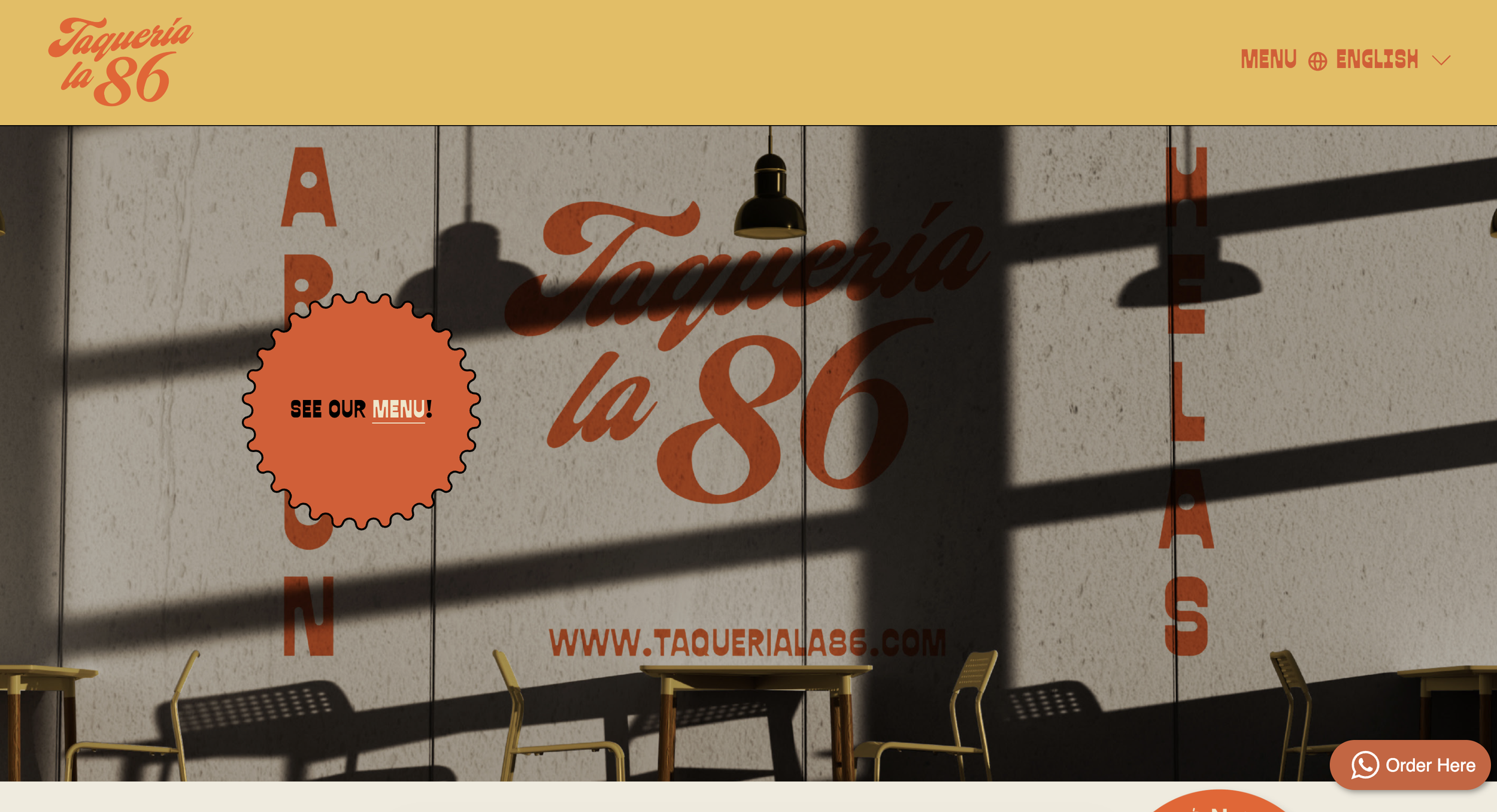 Photo of a restaurant storefront with large text reading 'Taquería la 86' and a website link, in front of a wall casting shadows of ceiling lamps and chairs outside.