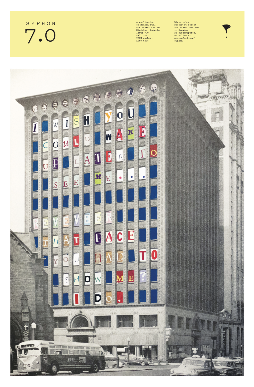 Black and white photograph of a tall building with a colorful message displayed using lettered tiles. The message reads: "I wish you could wake up later to remember that I face you and to show me?" a bus and several cars are parked in front of the building.