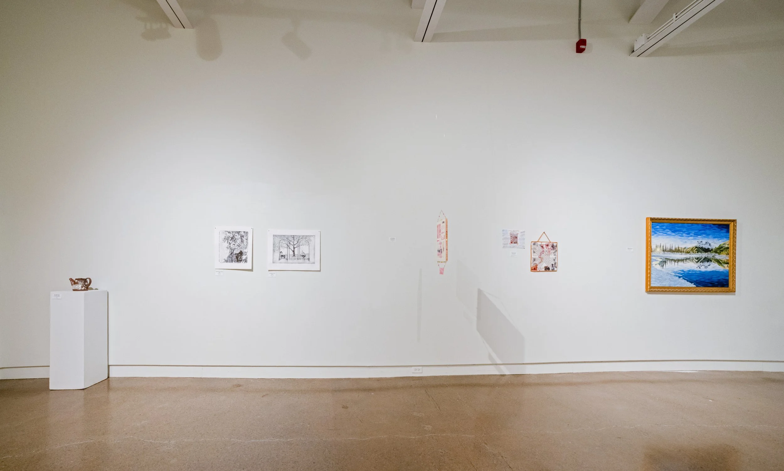 5 pieces of art work in the Main Gallery of Modern Fuel, including a teapot, 2 prints, a mixed media collage, a mixed media textile, and an oil on canvas.