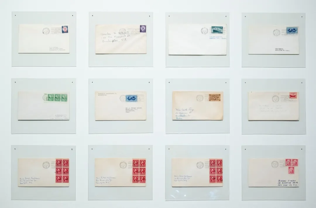 Collection of nine old envelopes with various postage stamps and postmarks displayed on a white background.