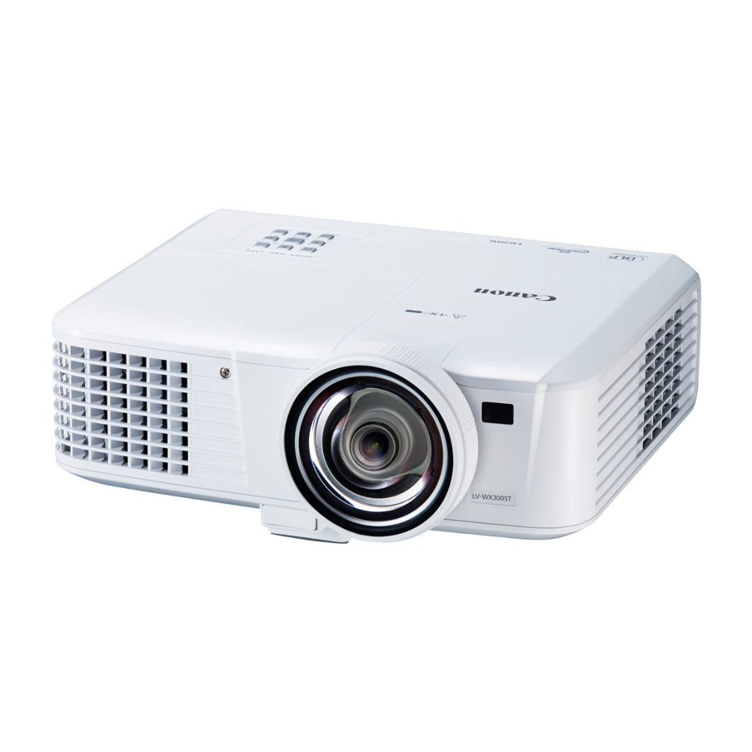 White Canon projector with lens and ventilation grills on the sides.