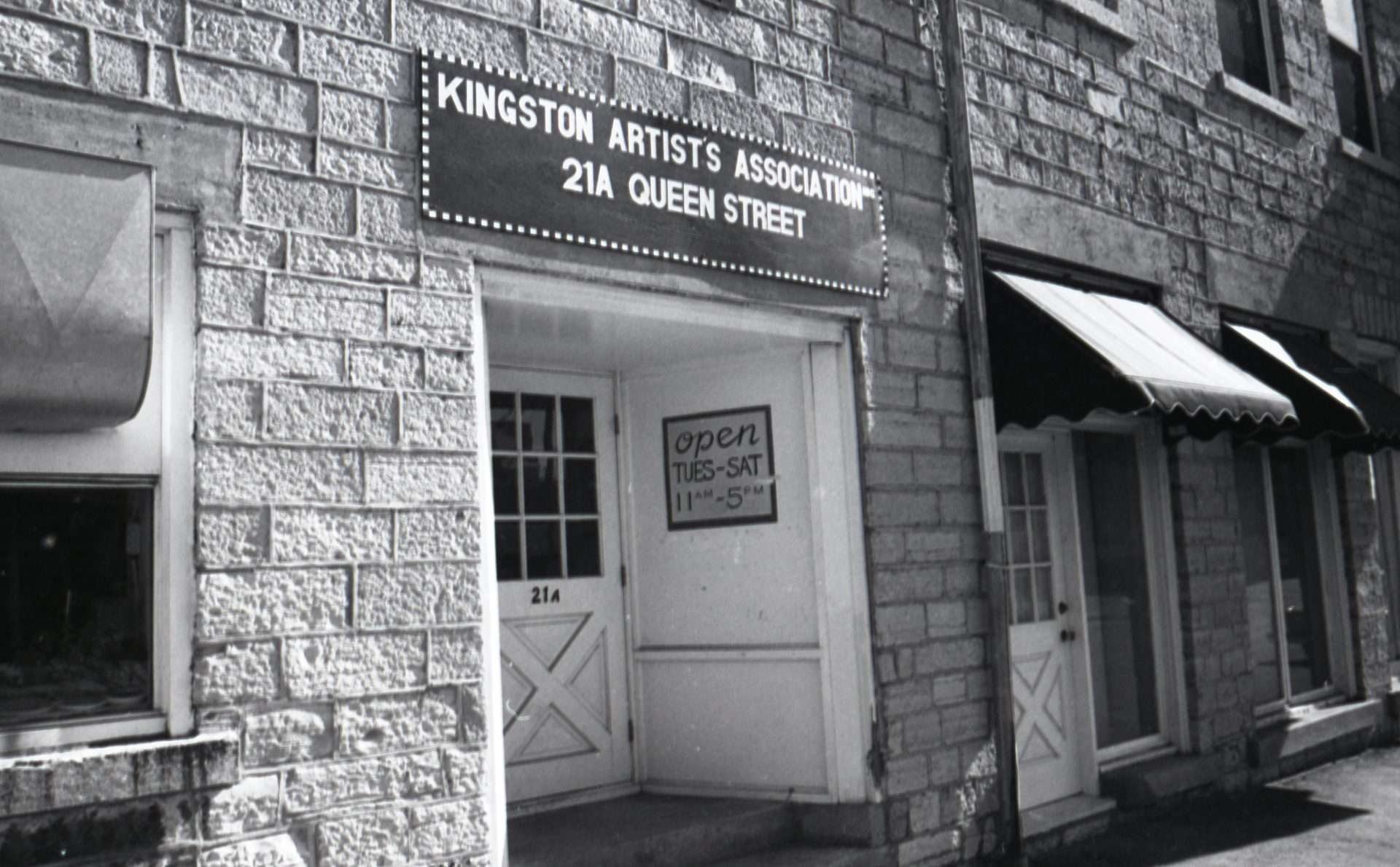 Black and White photo of a sign reading "Kingston Artist's Association"