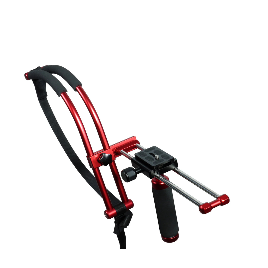 A red and black ski training pulley with handles and adjustable straps.