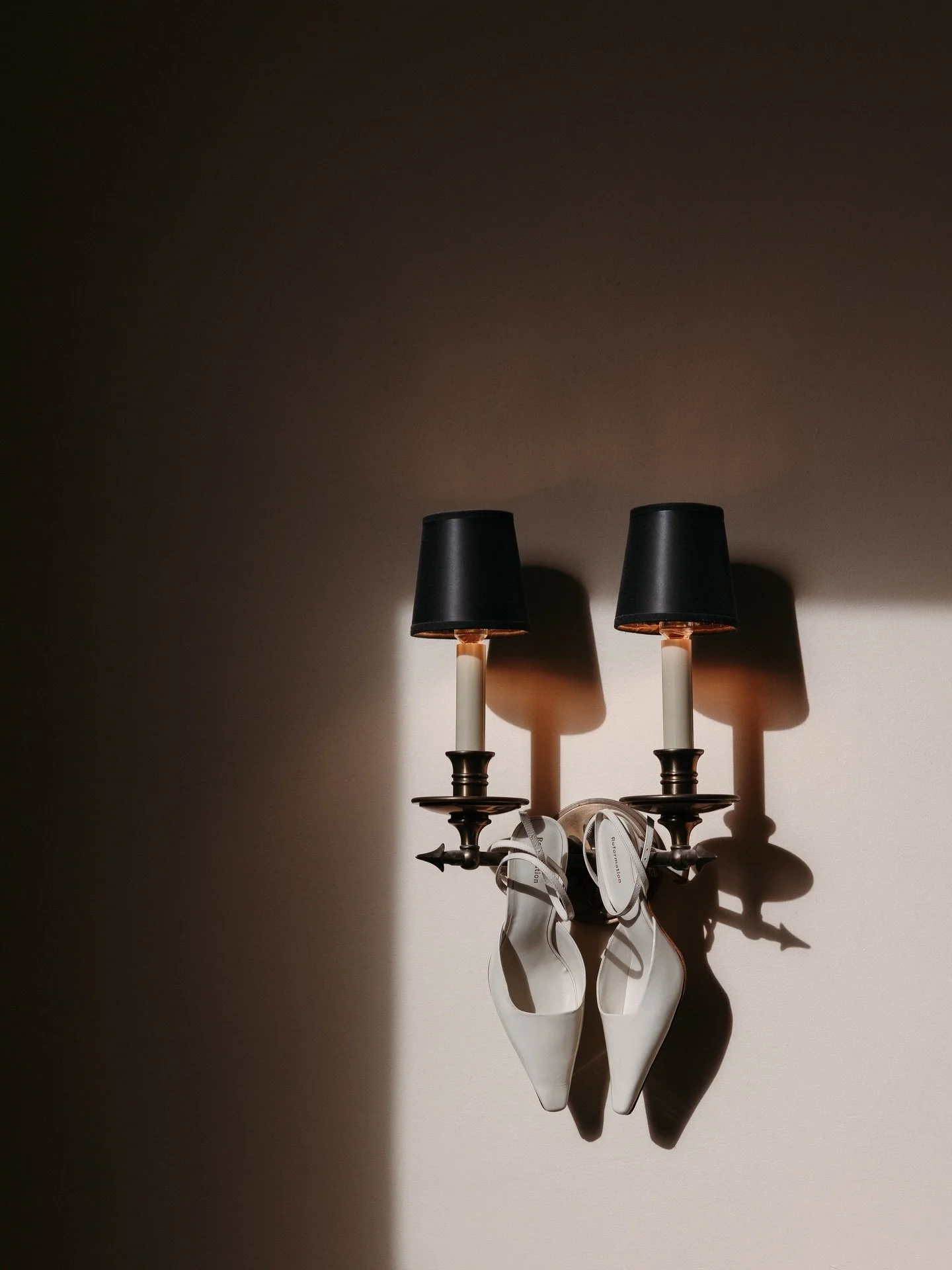 Because every wedding day needs at least one &ldquo;let&rsquo;s hang the bride&rsquo;s shoes somewhere random&rdquo; shot.