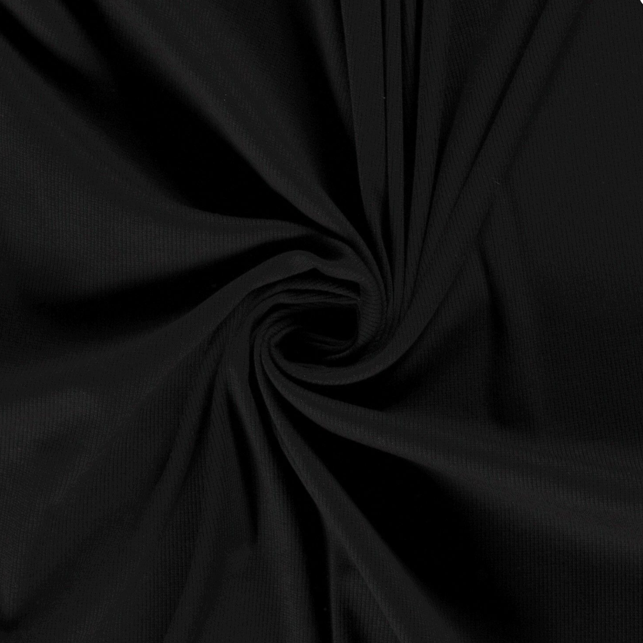 Black fabric with a smooth, textured surface, twisted into a spiral pattern.